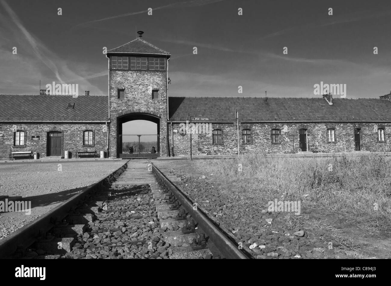 Black and white image of train entrance to Auschwitz II - Birkenau extermination camp, Oswiecim, Poland Stock Photo