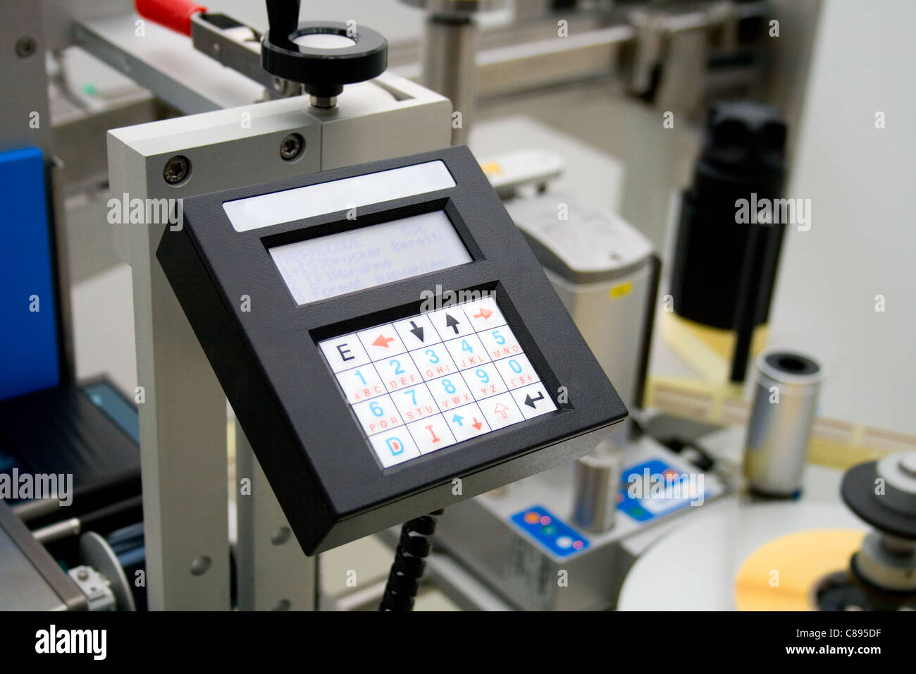 Medicine production in a pharmaceutical industry. Control panel labeling machine. Stock Photo