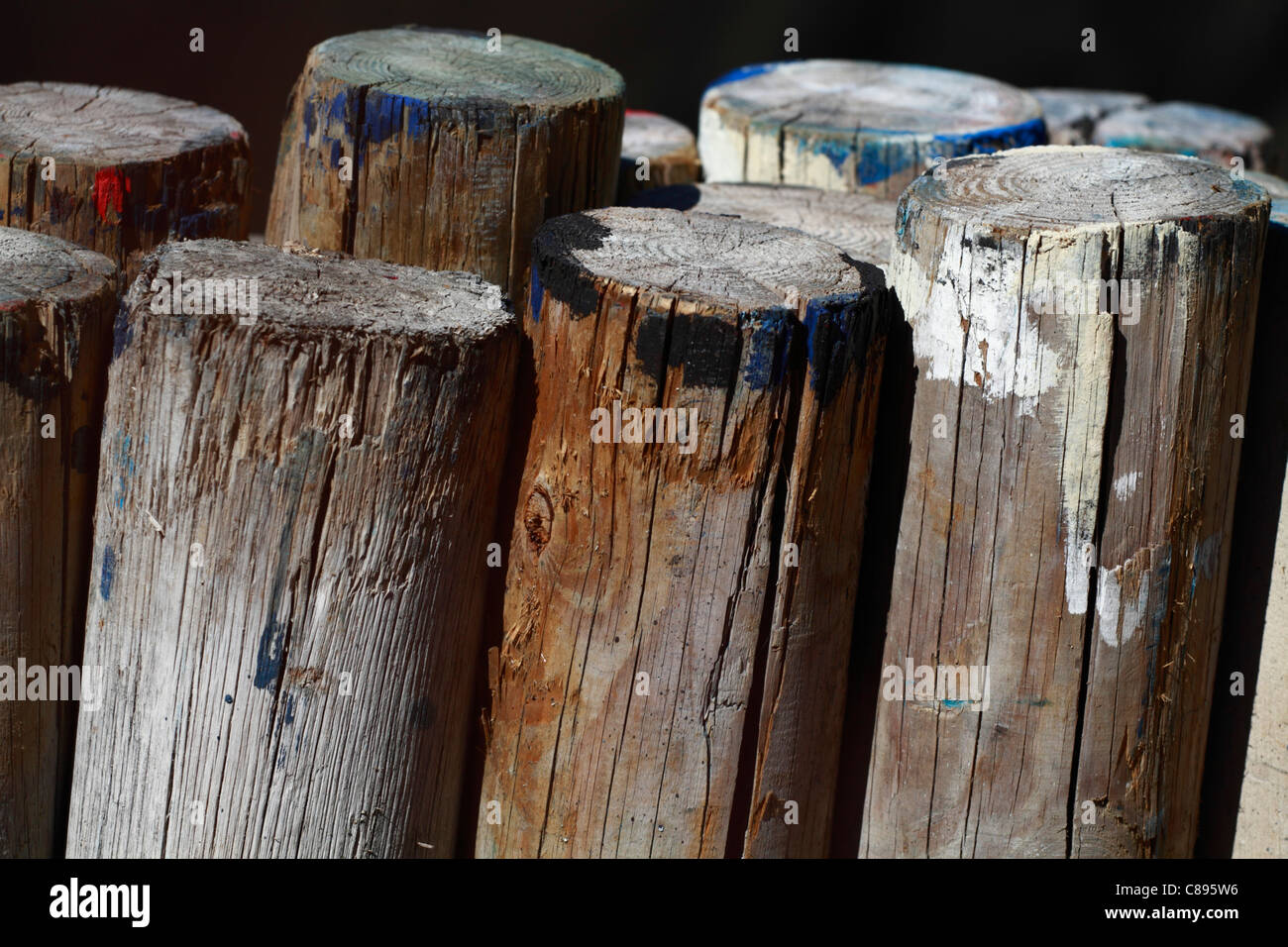 Paint stained wooden logs Stock Photo Alamy