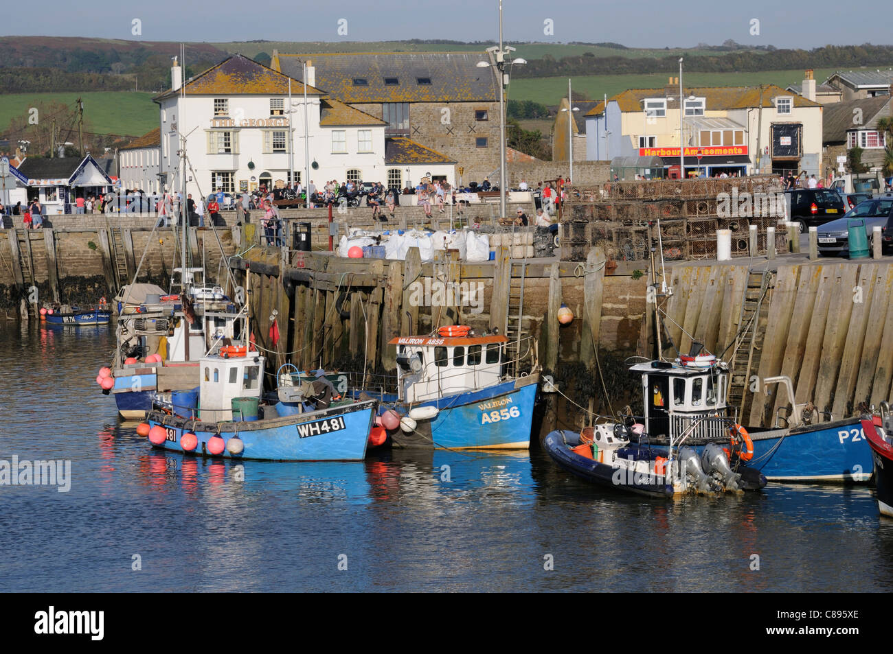 Commercial fishing boats in the harbour at West Bay in Dorset England ...