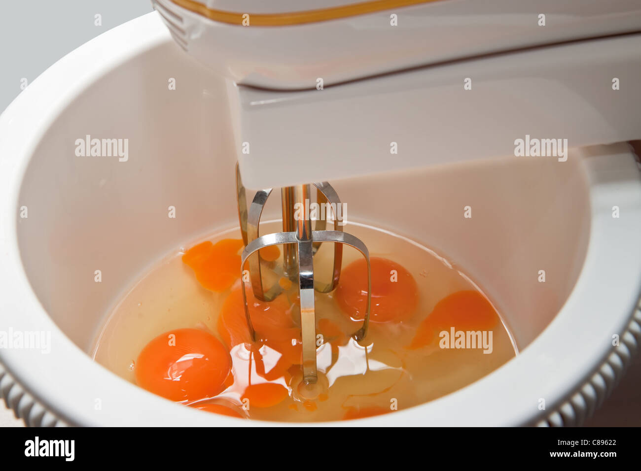 Beating eggs with a mixer Stock Photo Alamy