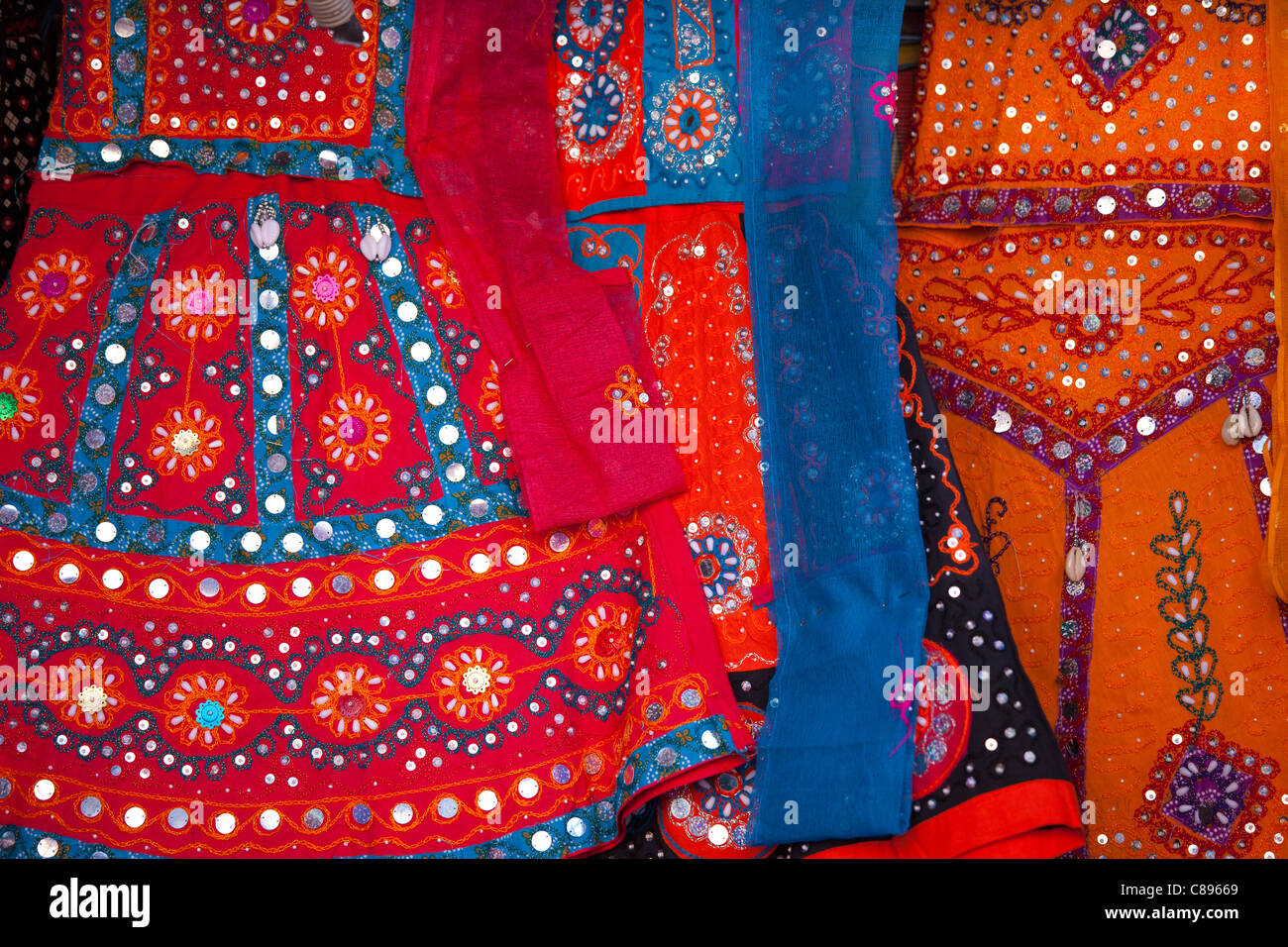 Traditional muslim lehanga dresses on display at stall in bazaar in Jaipur, Rajasthan, Northern India Stock Photo