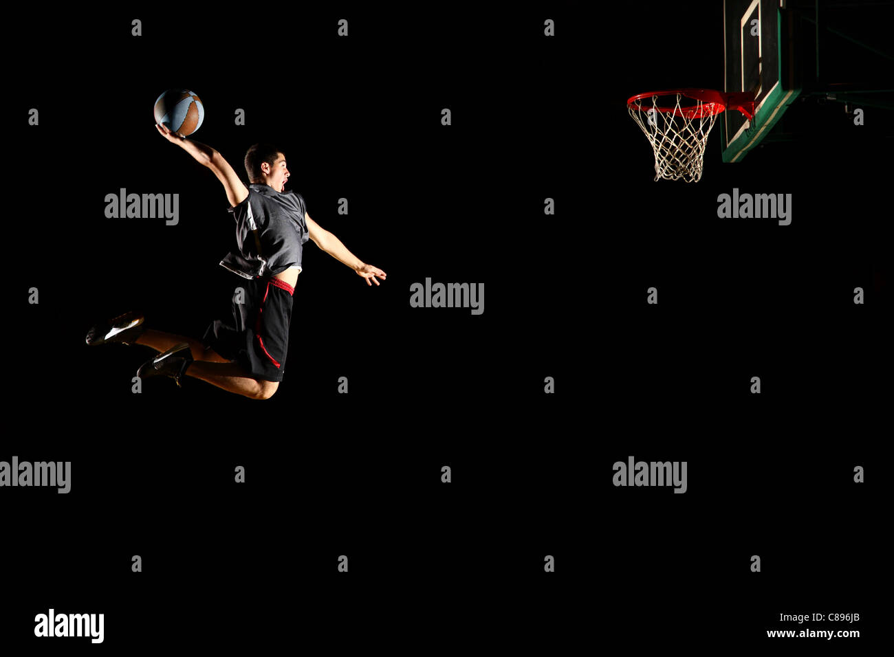 Basketball jump isolated on black background Stock Photo