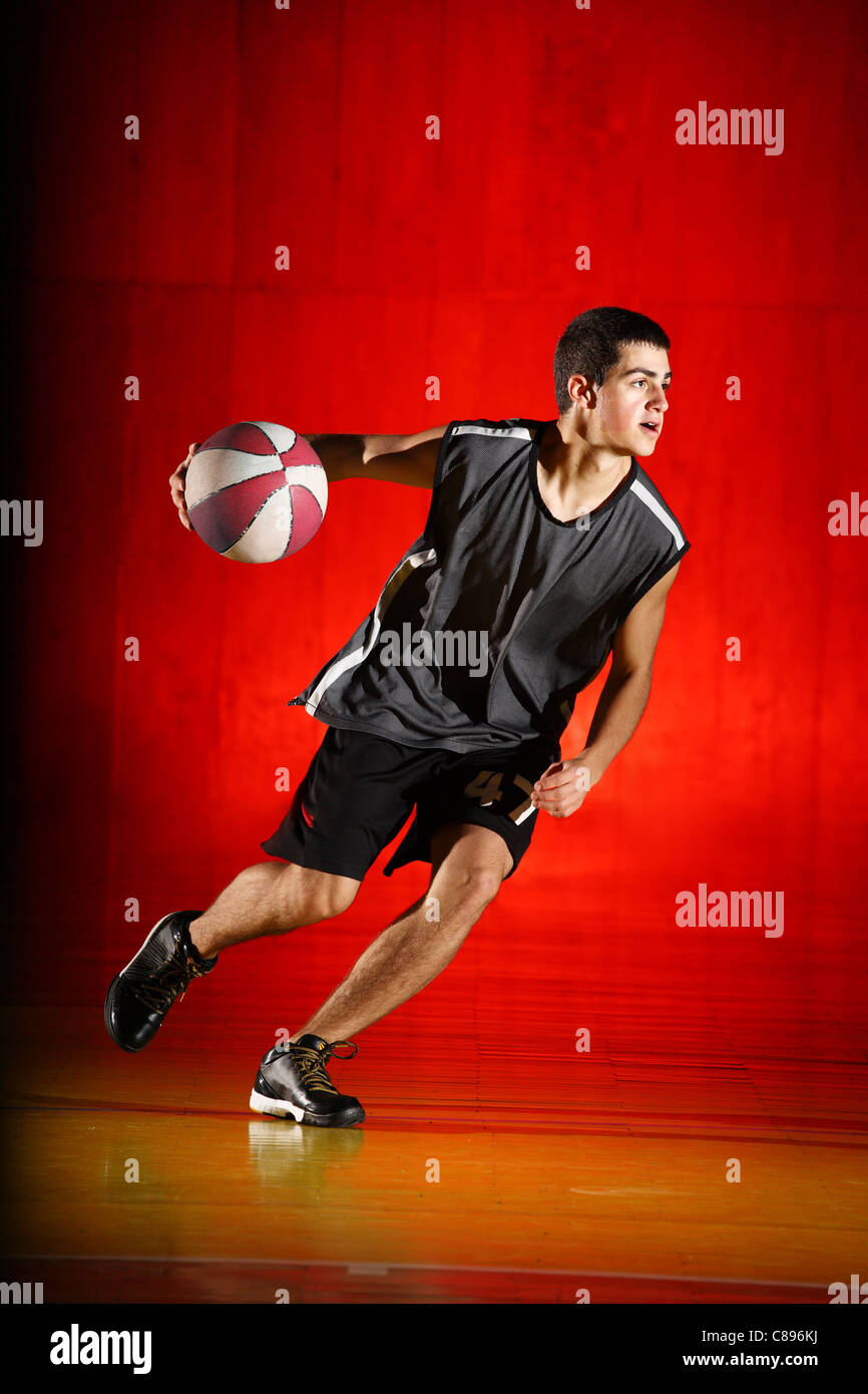 Basketball run on red background Stock Photo