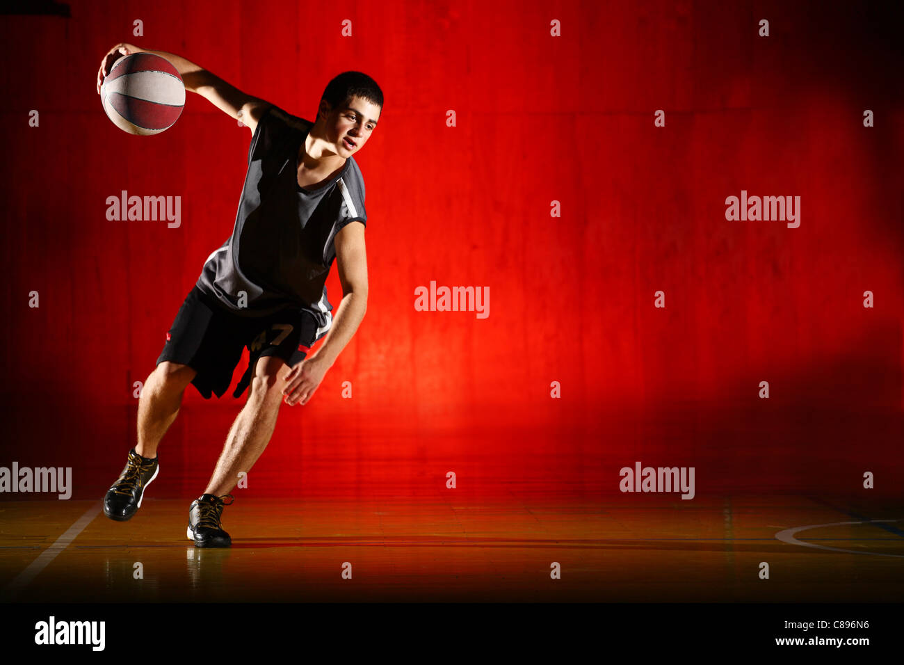 Basketball run on red background Stock Photo Alamy