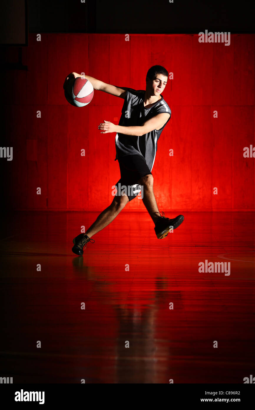 Basketball run on red background Stock Photo