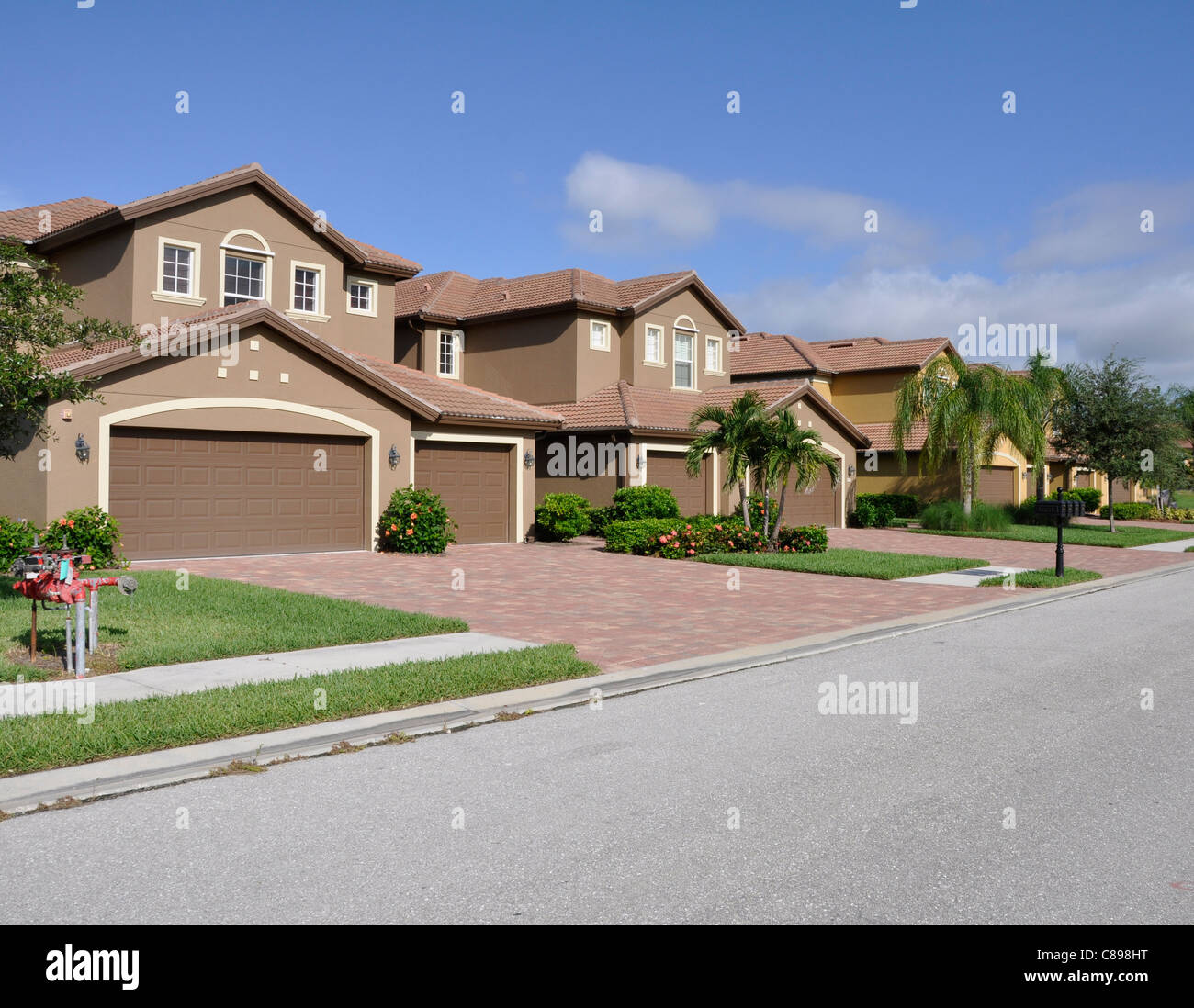 Row of typical modern homes in a development in Naples Florida Stock Photo