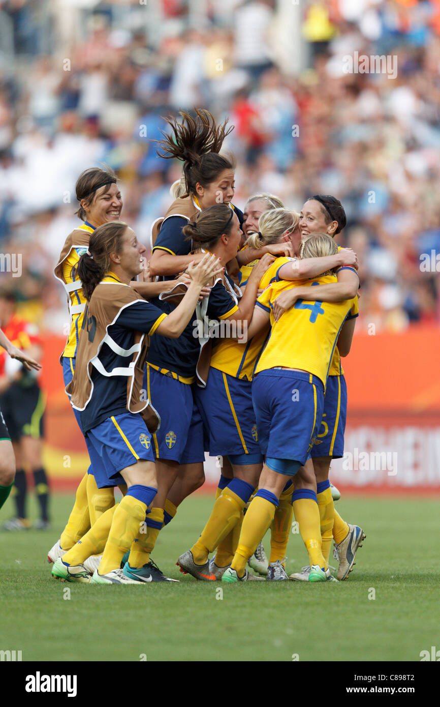Sweden players celebrate after defeating France in the FIFA Women's World Cup third place match at Rhein Neckar Arena. Stock Photo
