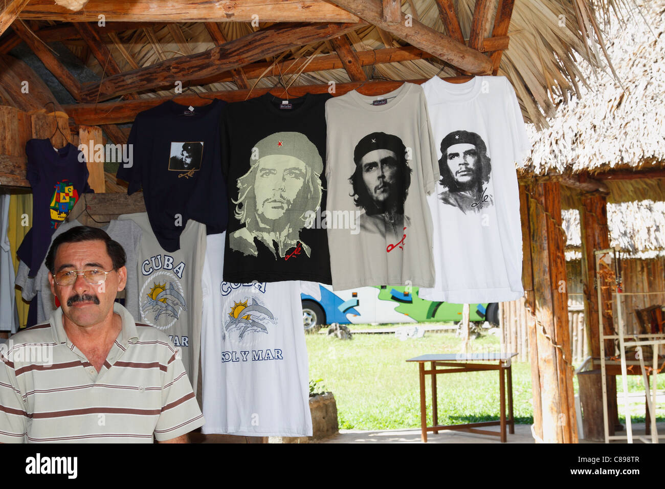 Cuban salesman and Che Guevara printed t-shirts for sale in Cuba, November, 2010 Stock Photo