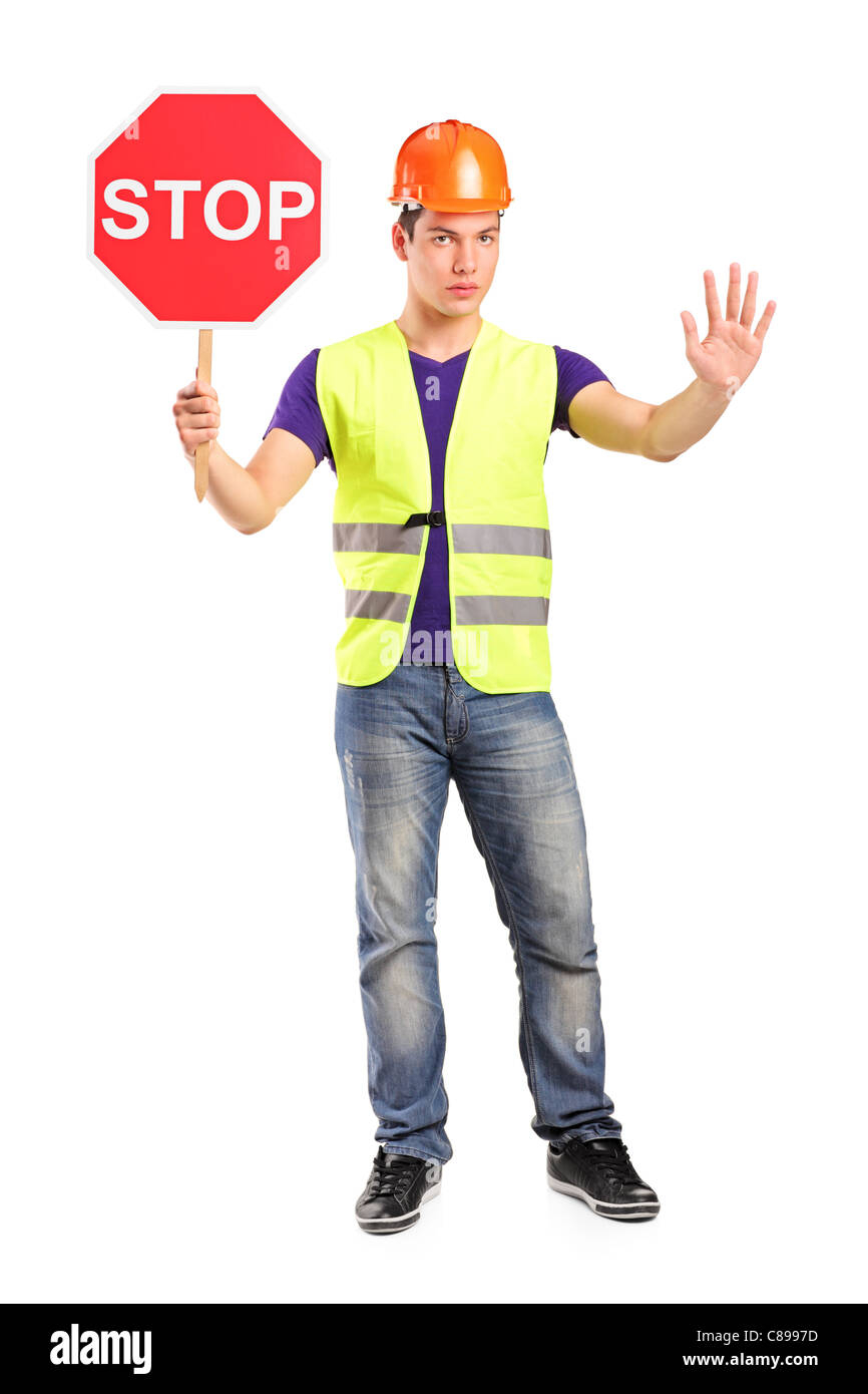 Full length portrait of a construction worker holding a traffic sign ...