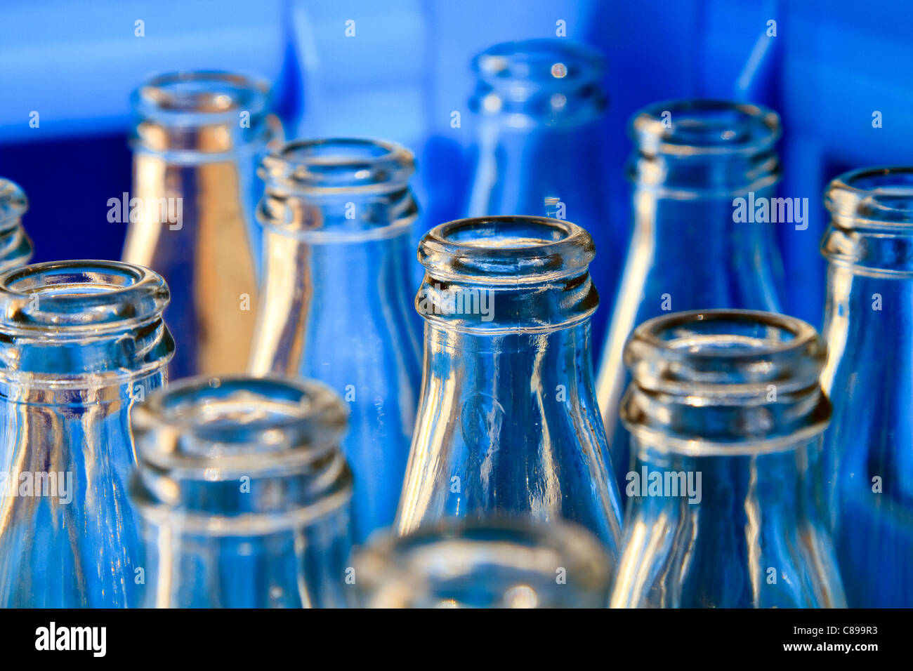 Empty bottles in a blue crate close up Stock Photo Alamy