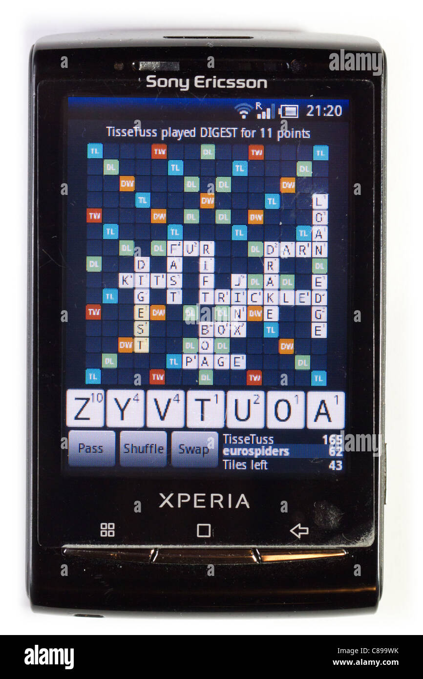 Playing the popular Scrabble-like game Wordfeud on the Android smartphone Sony Ericsson XPERIA X10 mini. Stock Photo