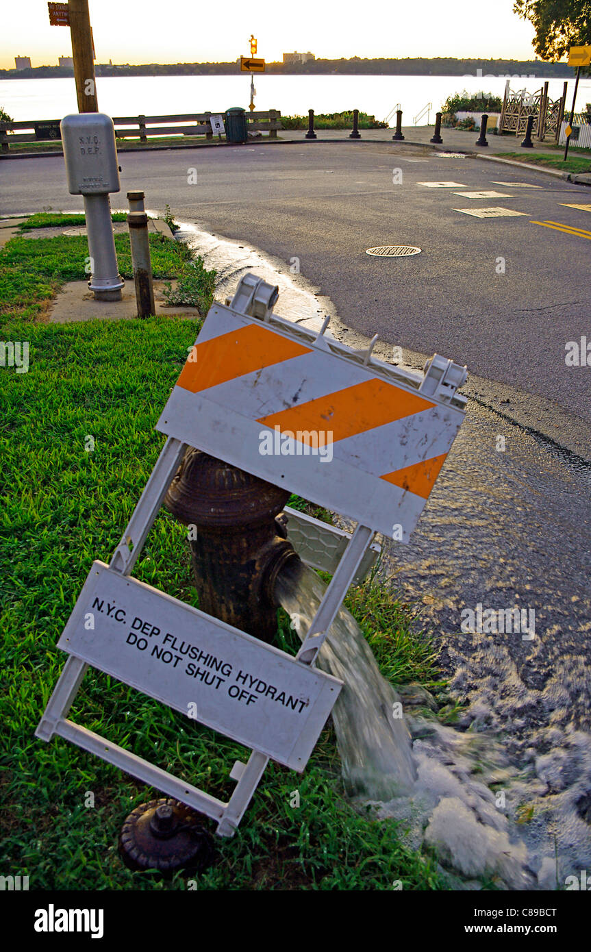 Water department flushing the water system by opening the water hydrant