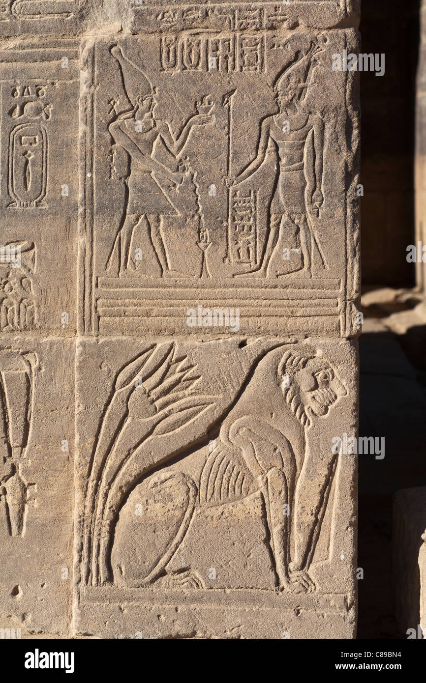 Relief of Lion and gods on gateway at the Temple of Hathor, Temple of Isis at Philae, Aglika Island, Aswan Upper Egypt Stock Photo