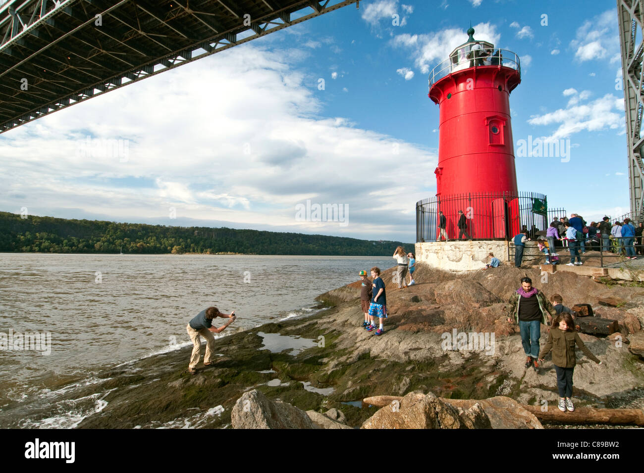 The Little Red Lighthouse, officially Jeffrey's Hook Lighthouse, at the base of the George Washington Bridge in New York City. Stock Photo