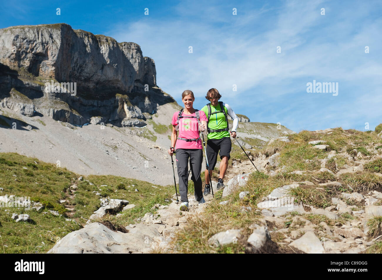Woman hiking on mountain trail hi-res stock photography and images - Alamy