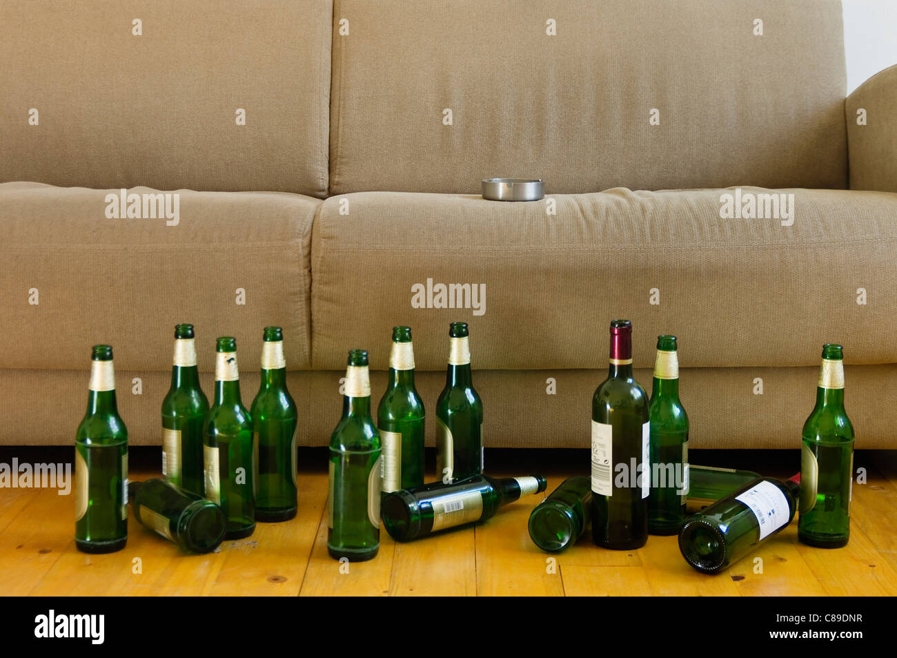 Germany, Hessen, Frankfurt, Sofa with empty beer bottles Stock Photo