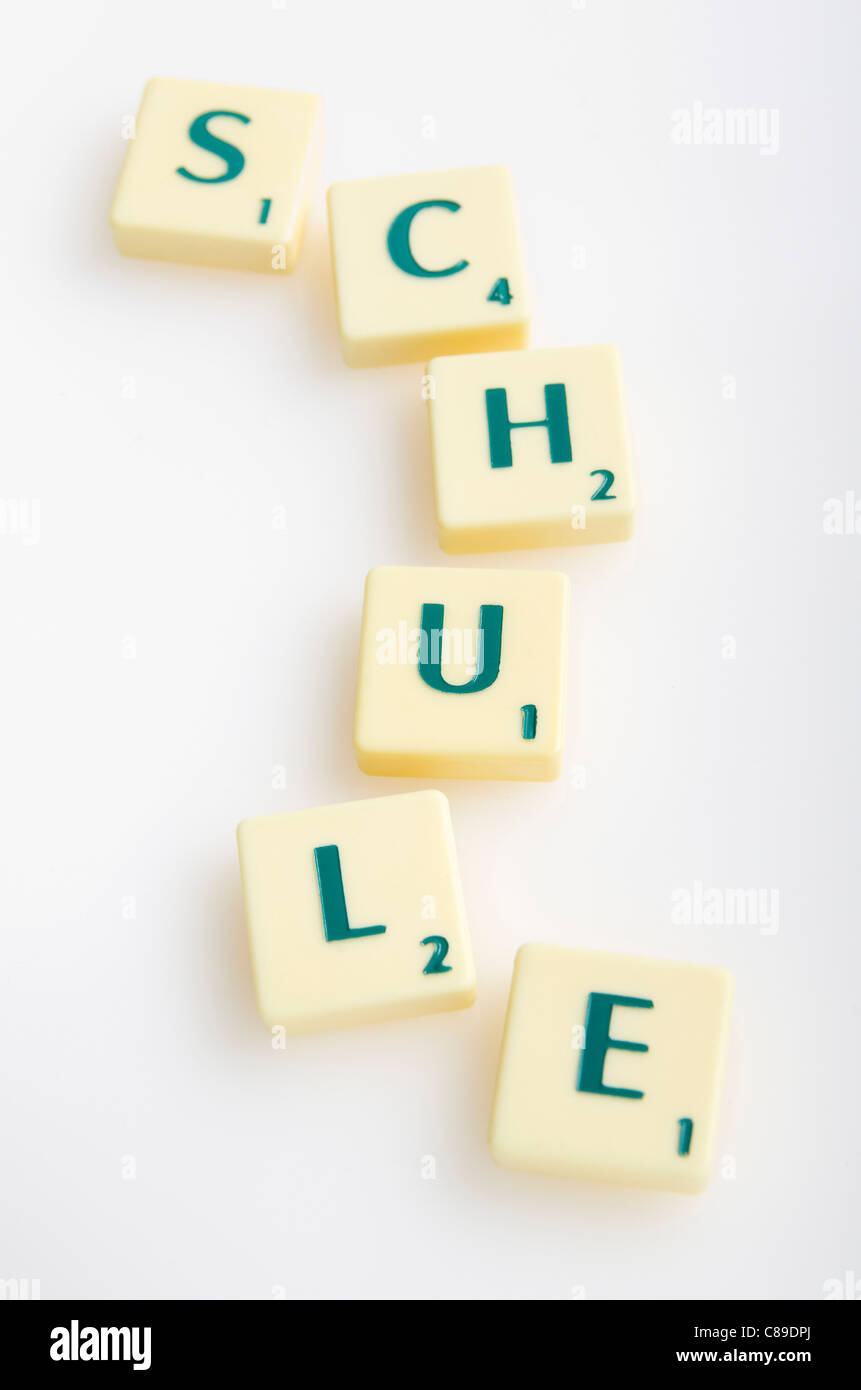 Scrabble game with word 'Schule' on white background Stock Photo