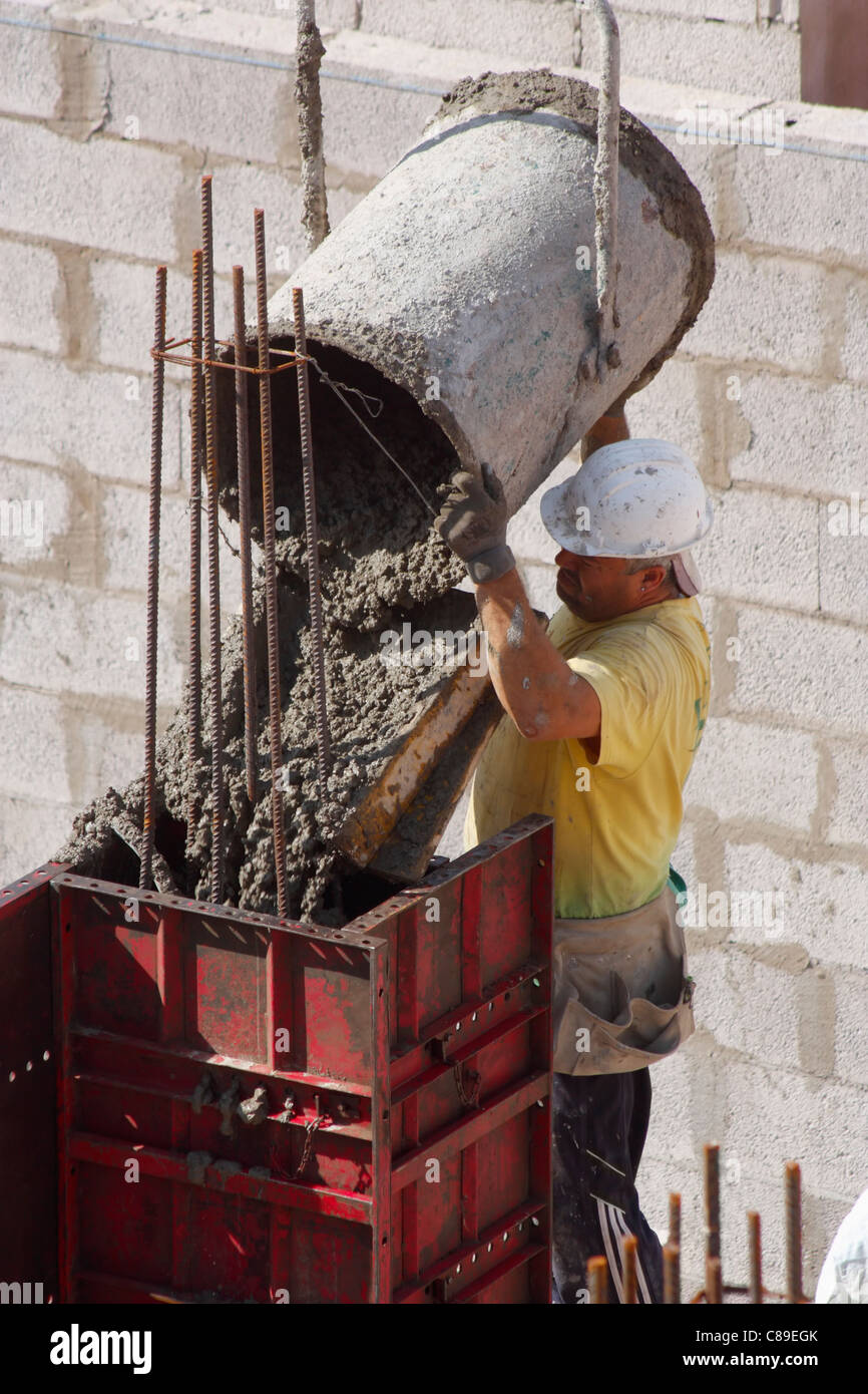 Pouring wet concrete, cement on building site Stock Photo Alamy