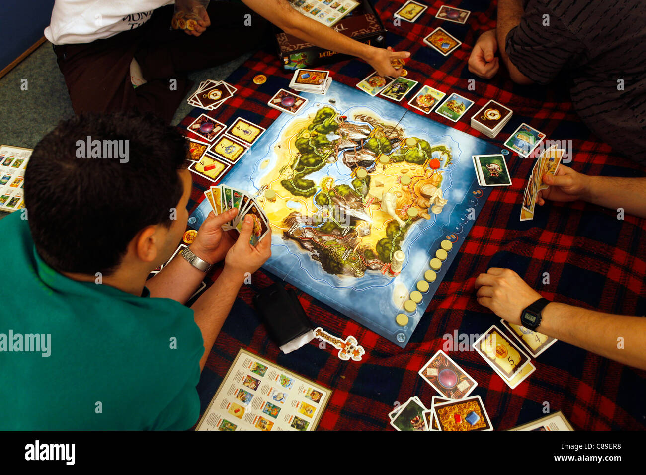 Gamers in Star Munchkin role-playing game (RPG) session Stock Photo