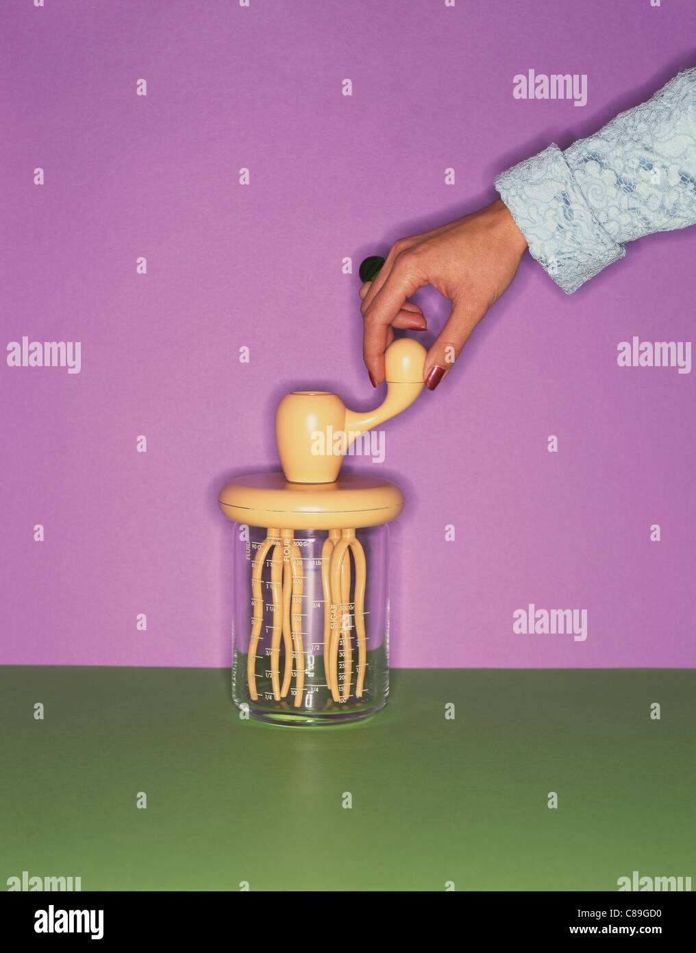 Whisk in a graduated glass jar Stock Photo Alamy