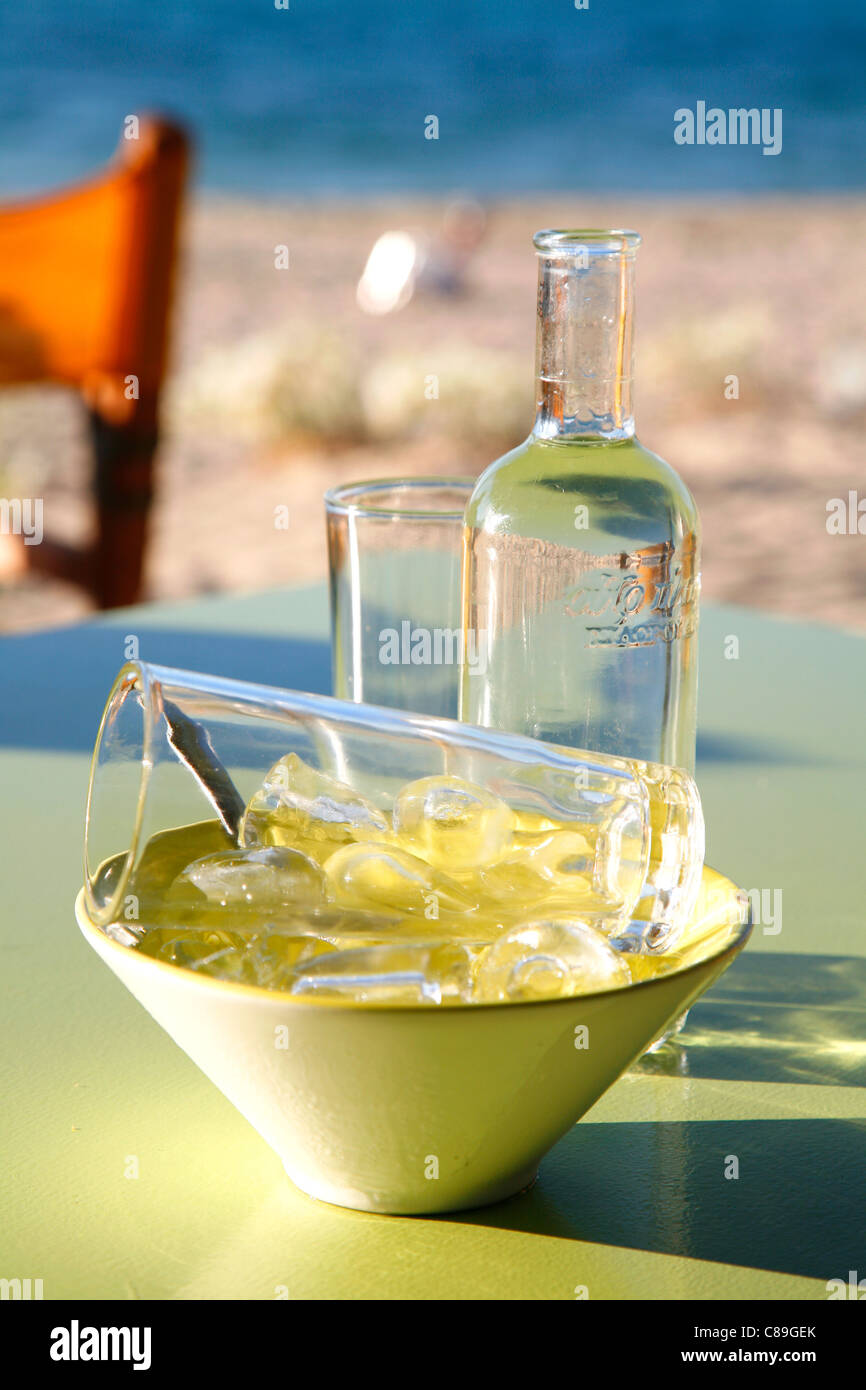 Ouzo,water and ice cubes Stock Photo - Alamy