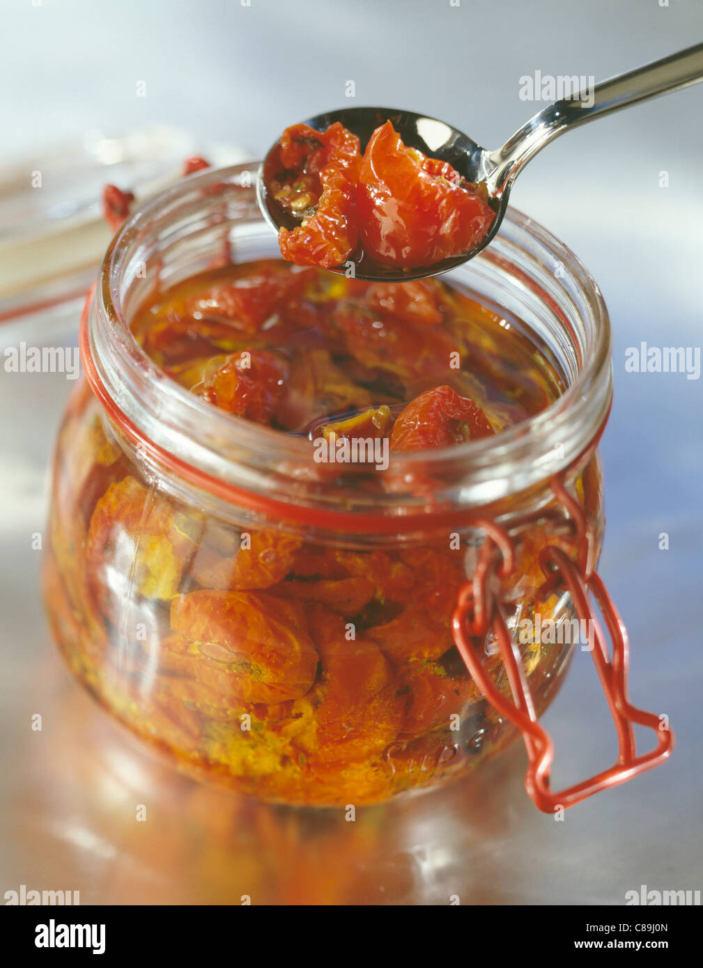 Jar of confit tomatoes Stock Photo Alamy