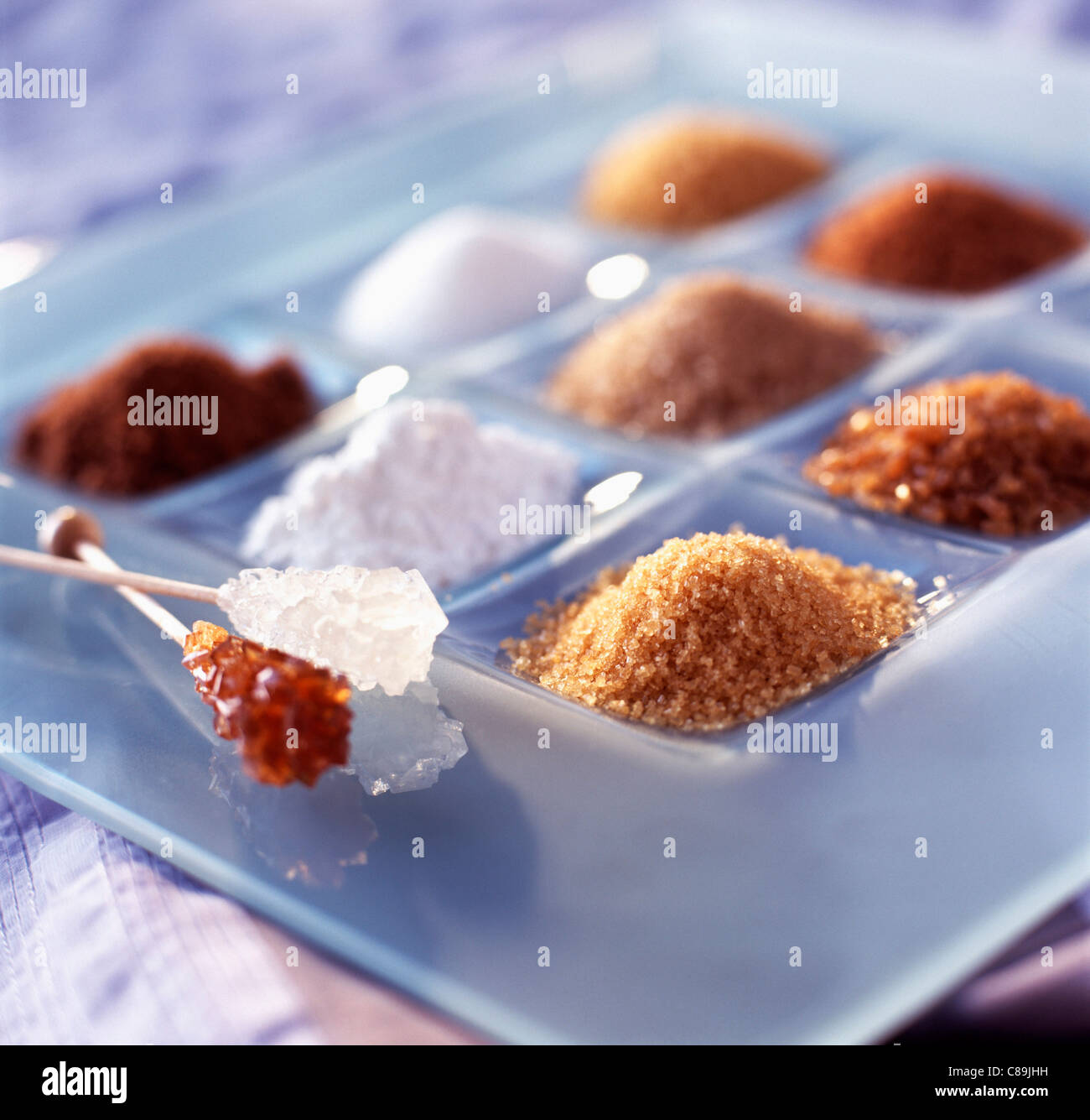 Powdered white, brown and Demerara sugar Stock Photo