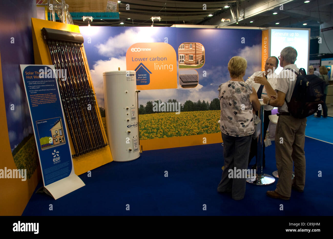 A salesman with potential customers at the 2011 Home Improvement Show. Stock Photo