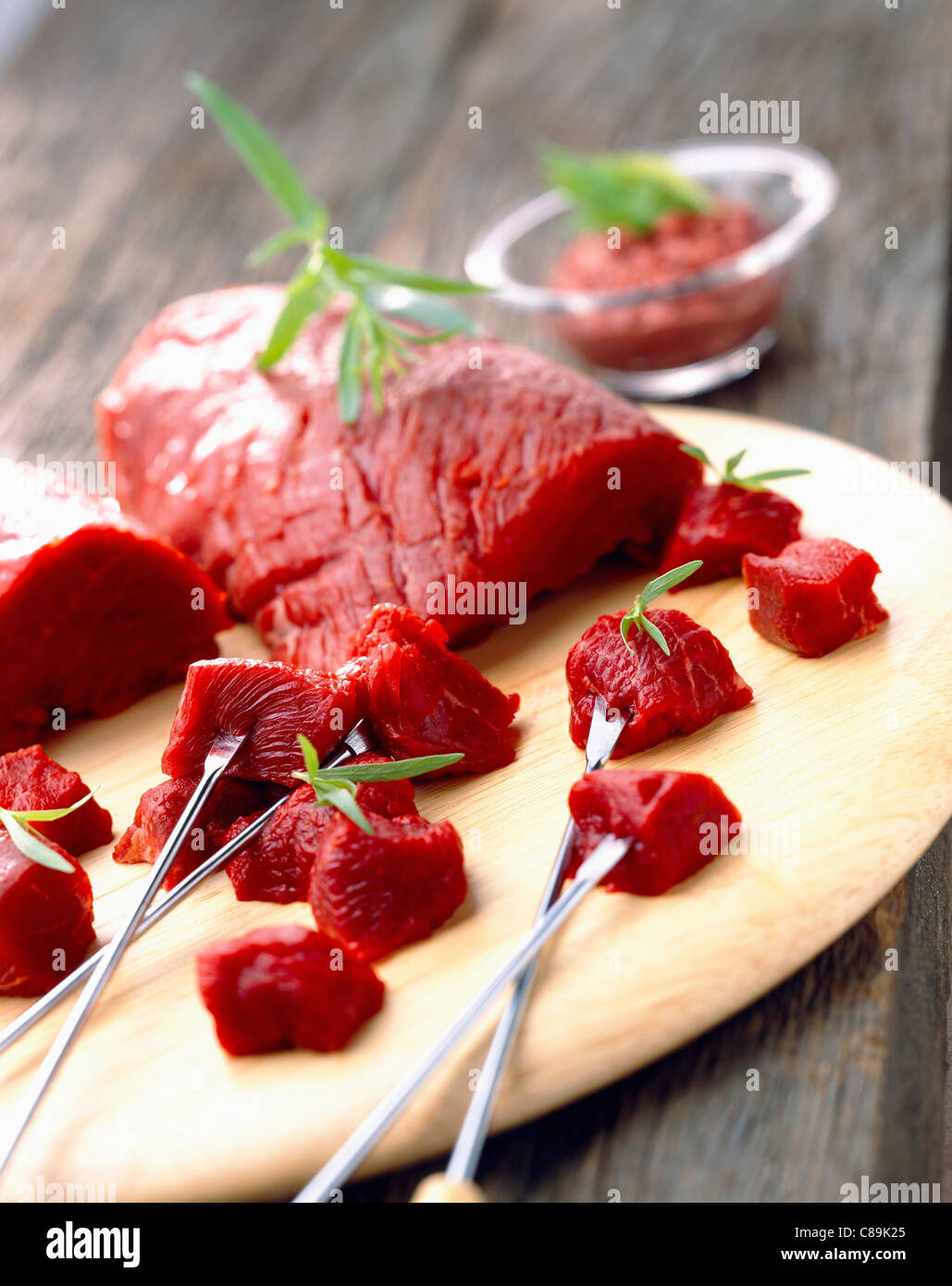 Raw beef for fondue Stock Photo Alamy