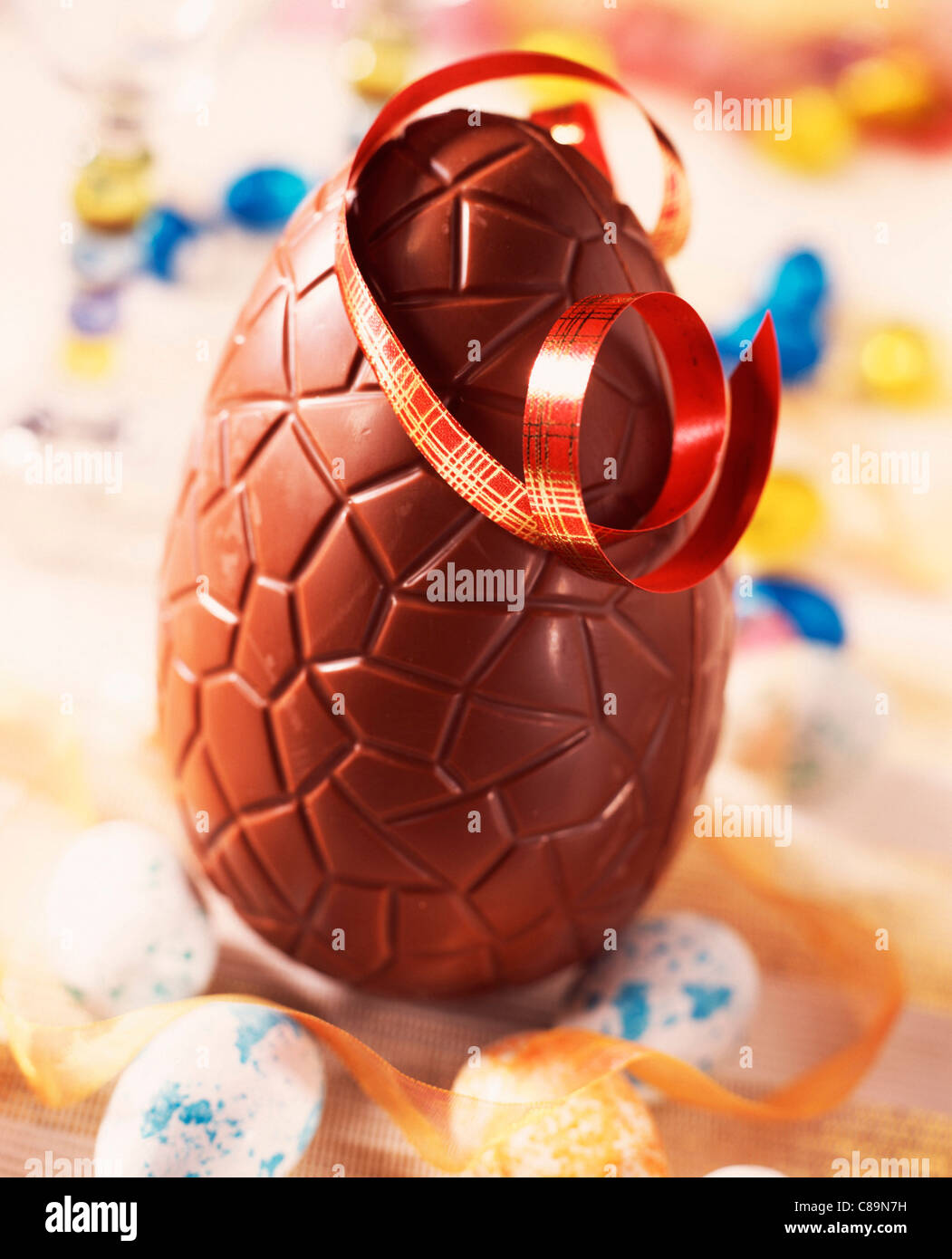Chocolate Easter egg with ribbon Stock Photo