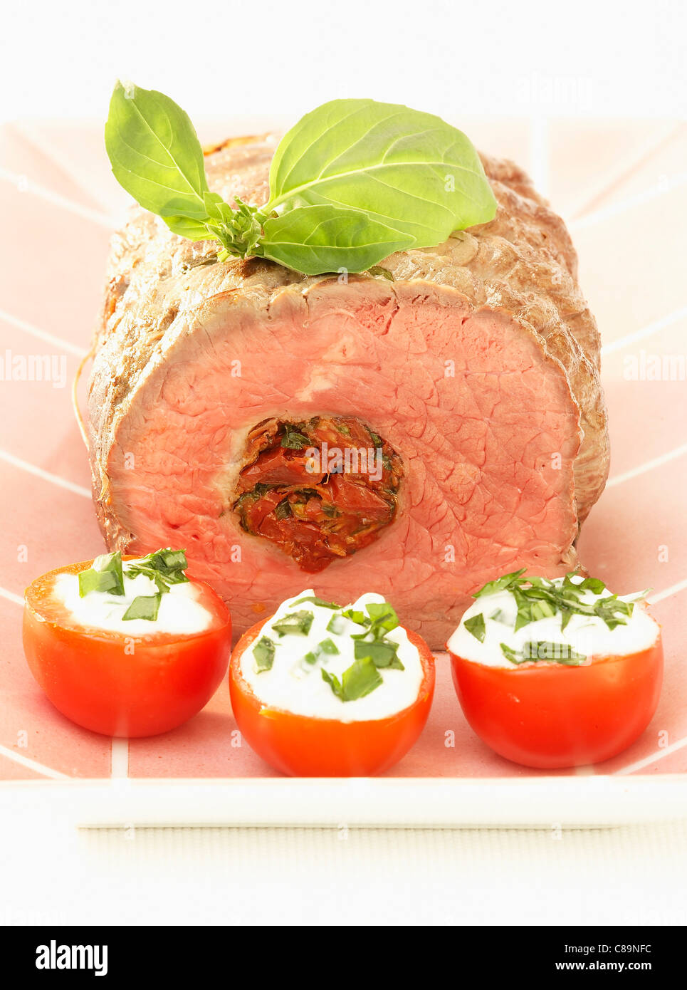 Beef fillet stuffed with dried tomatoes and basil Stock Photo Alamy