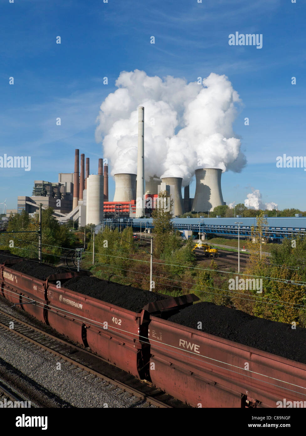 Train carrying brown coal at Neurath  coal fired power station in North Rhine Westphalia in Germany Stock Photo