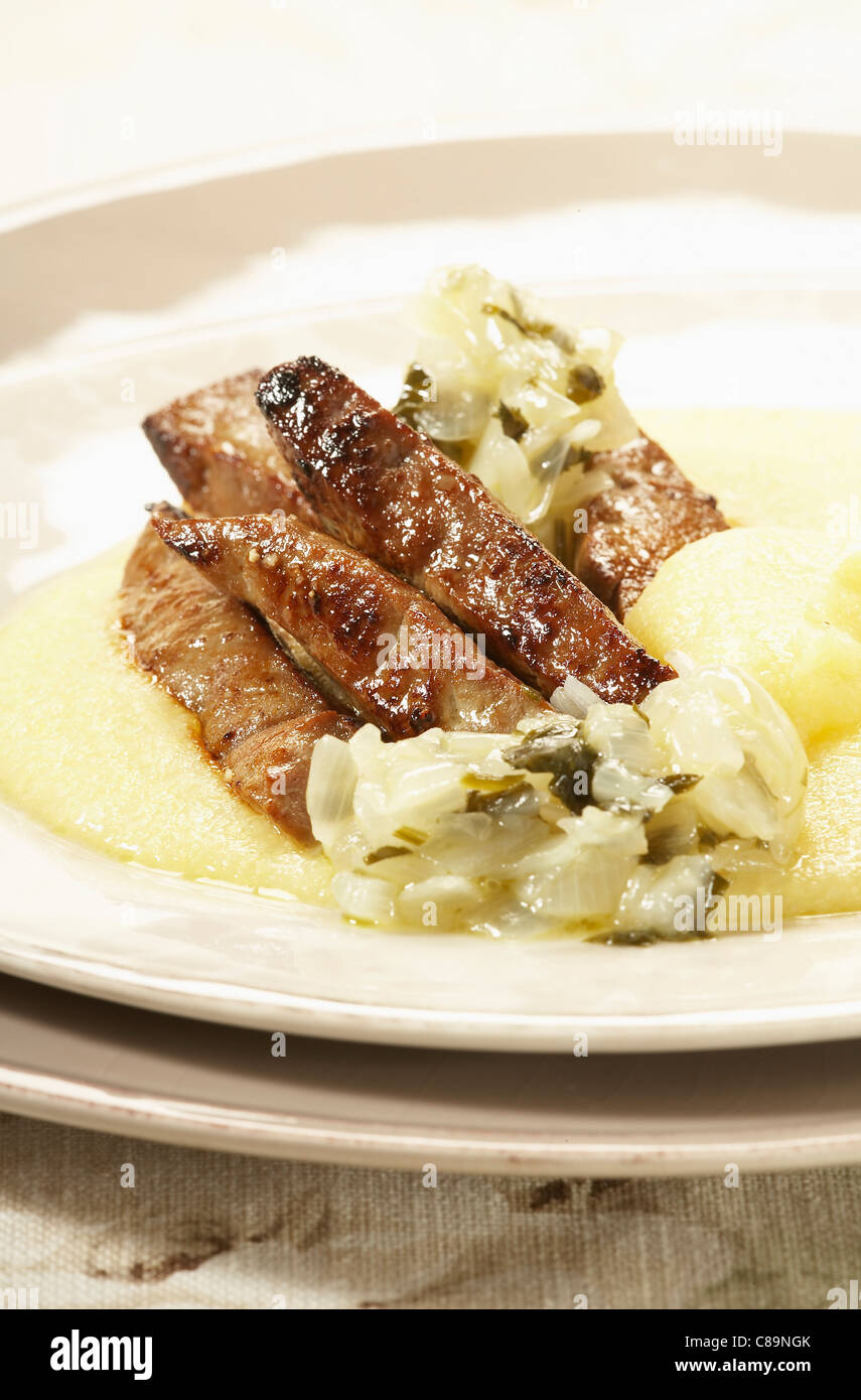 Venitianstyle veal liver with onions and polenta Stock Photo Alamy