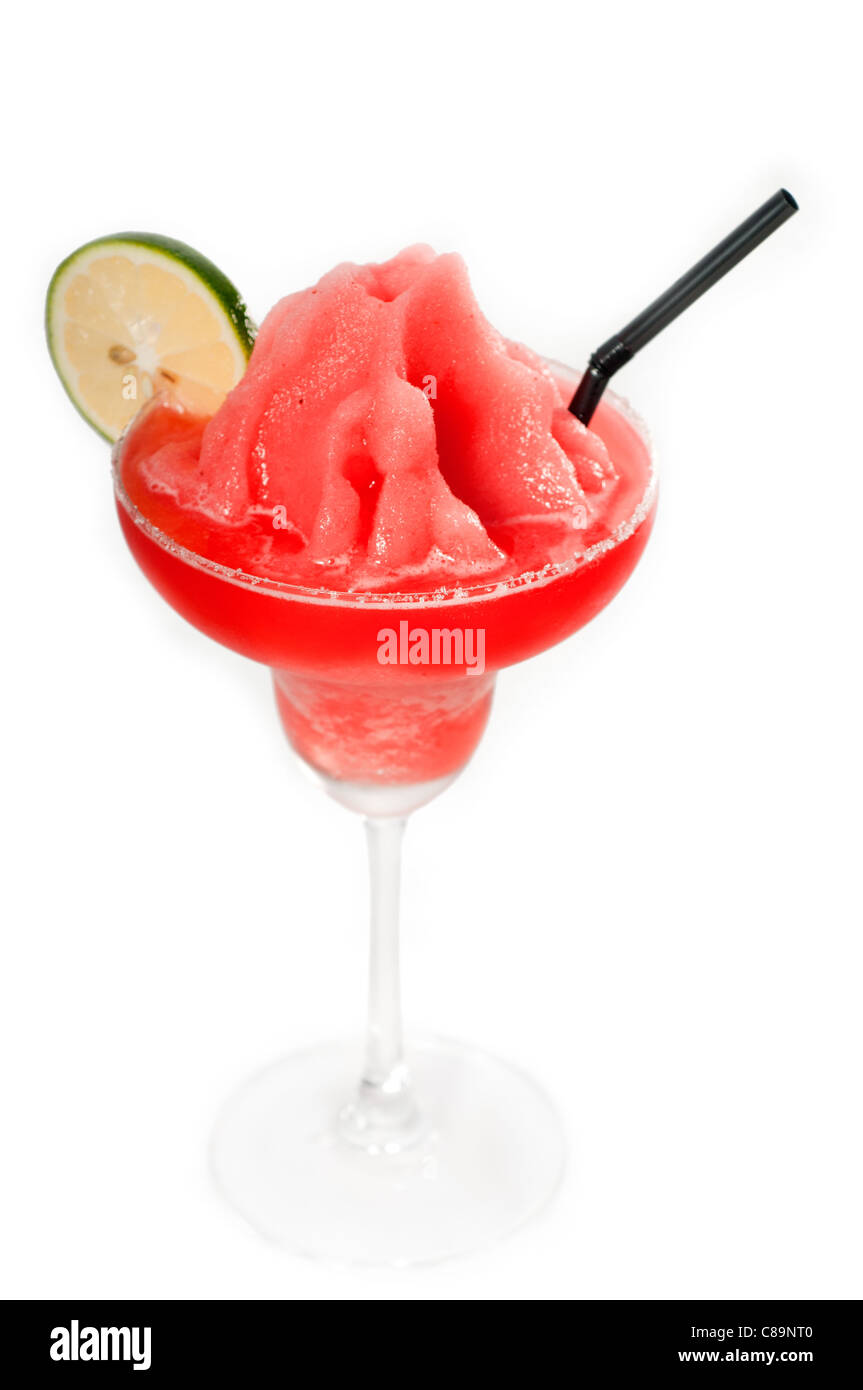 frozen strawberry margarita daiquiri with lime and black straw isolated on white background Stock Photo