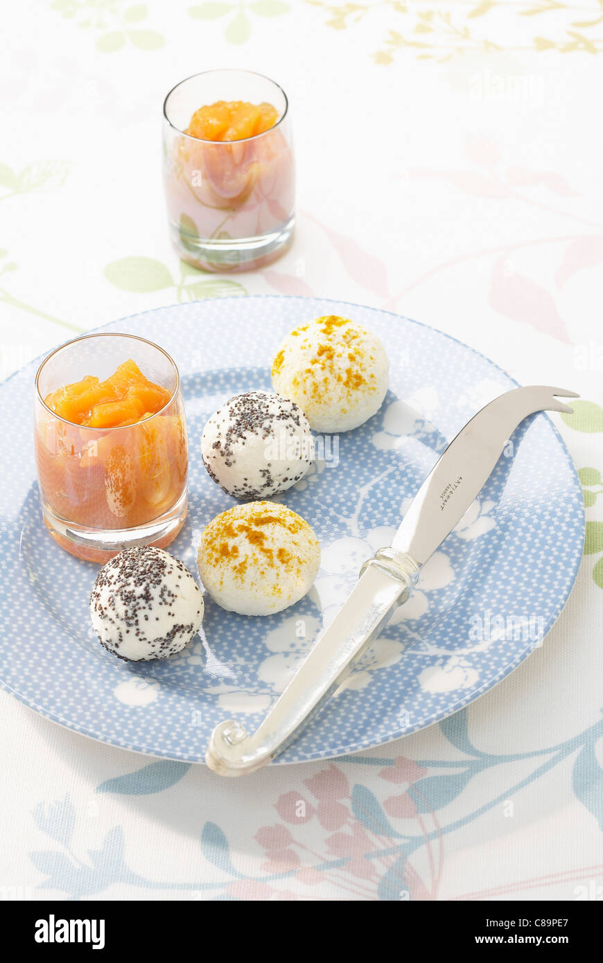Small spicy cheese balls with melon and ginger chutney Stock Photo
