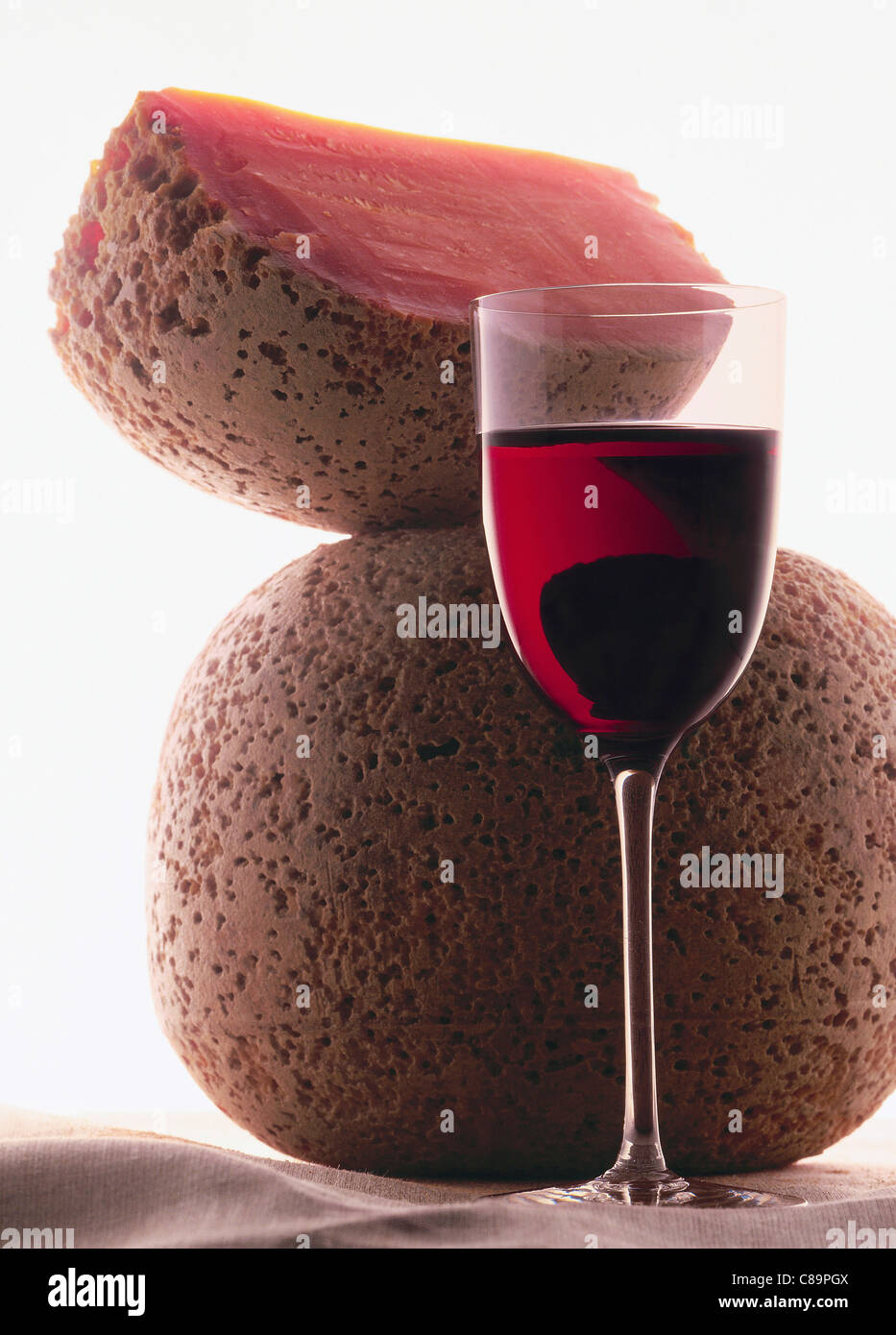 Mimolette cheese and glass of red wine Stock Photo