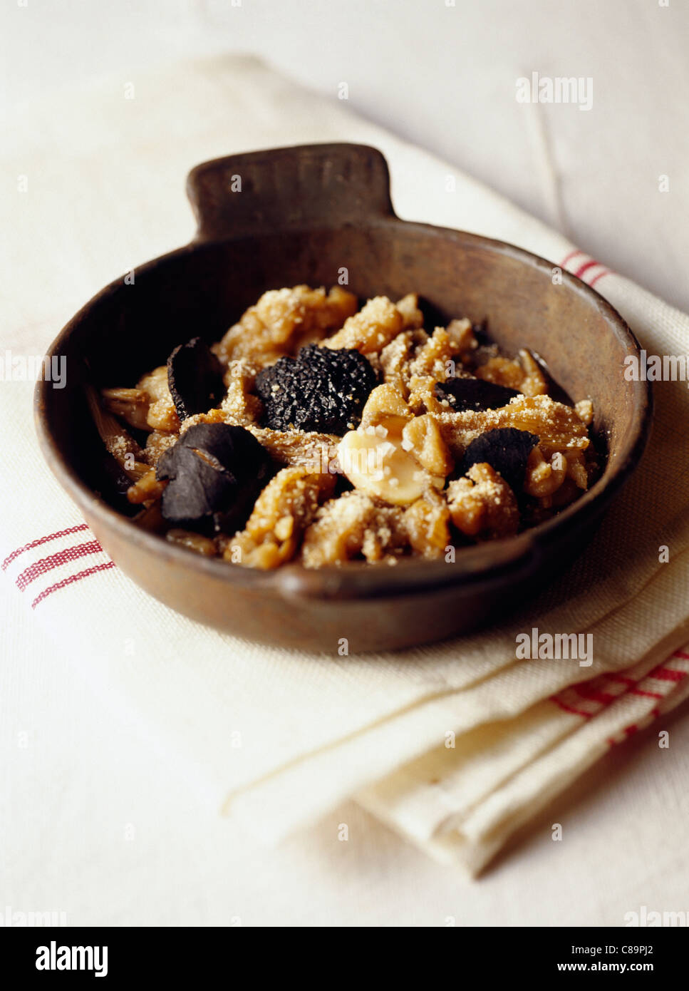 Chinese artichoke and cardoon gratin with marrow and truffles Stock Photo