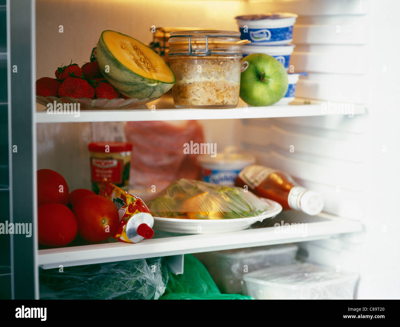 A refrigerator full of food Stock Photo