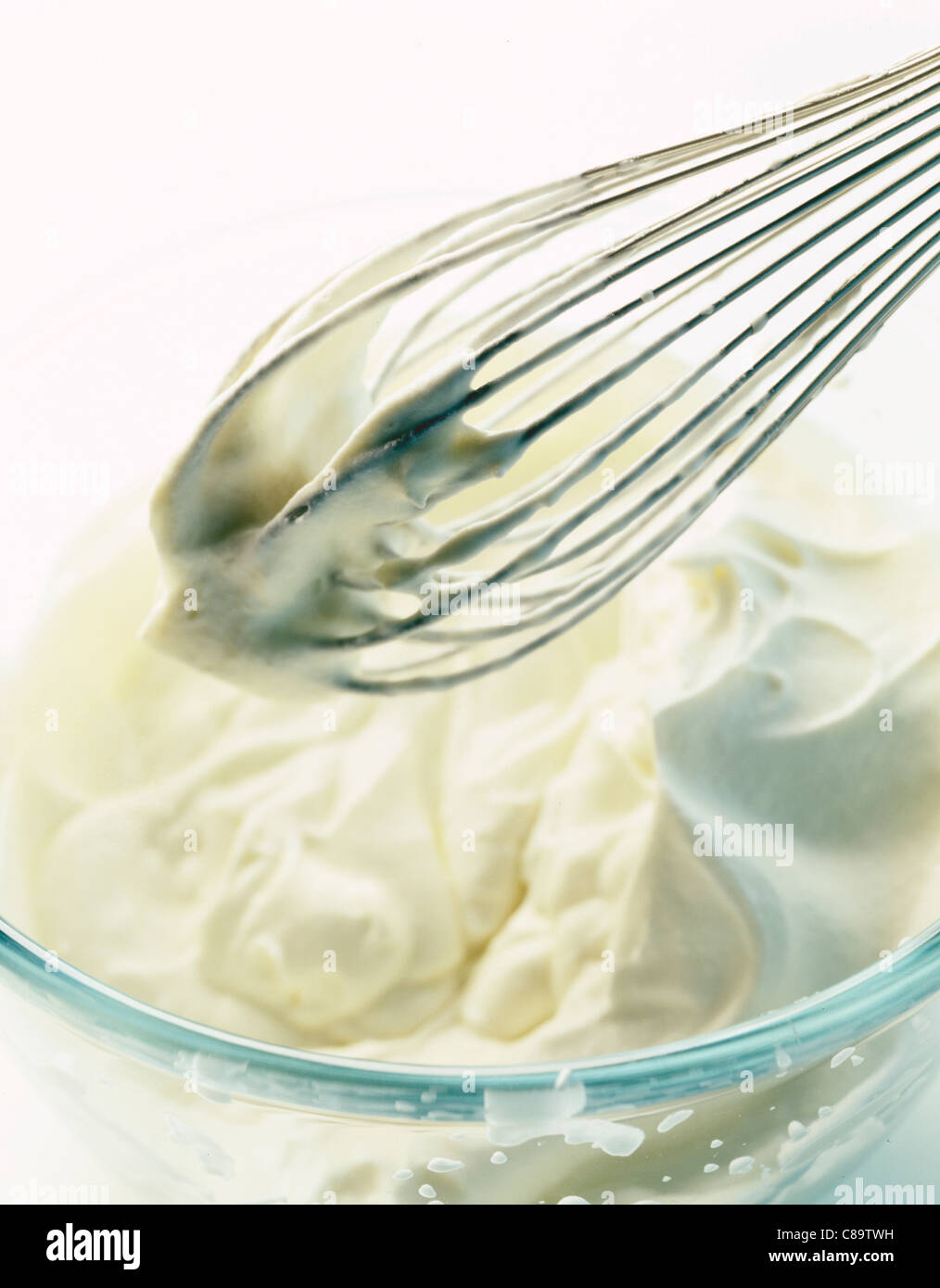 Hand whip and cream Stock Photo Alamy