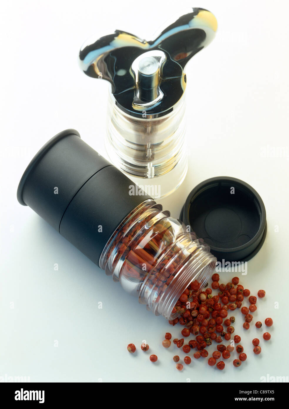 Peppercorns and grinder Stock Photo Alamy