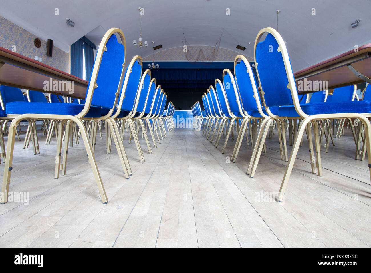 Chairs lined up neatly in the Miners Welfare Club in Horden, County Durham, England Stock Photo