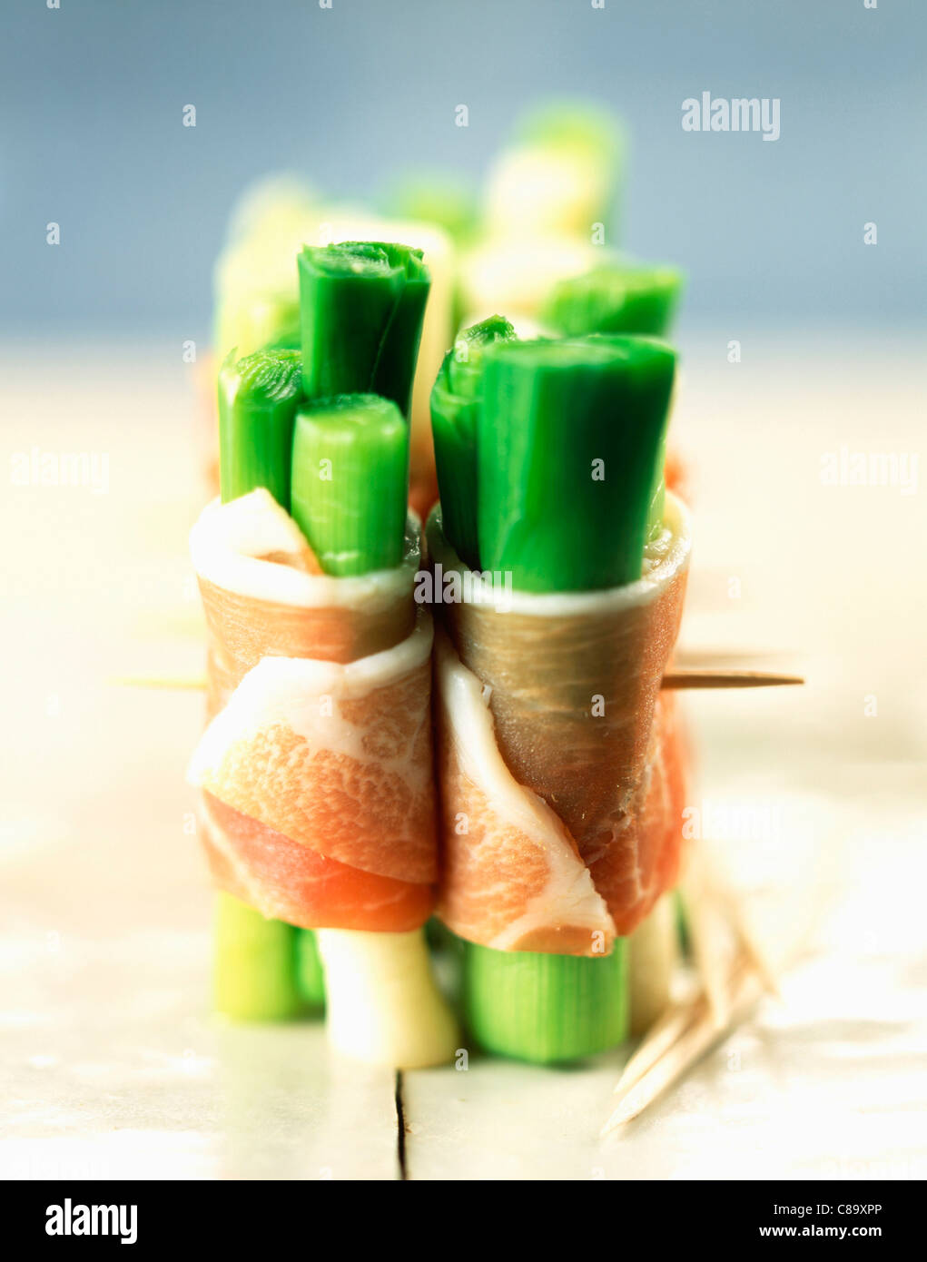 Leek Wrapped Leeks wrapped in bacon appetizers Stock Photo - Alamy