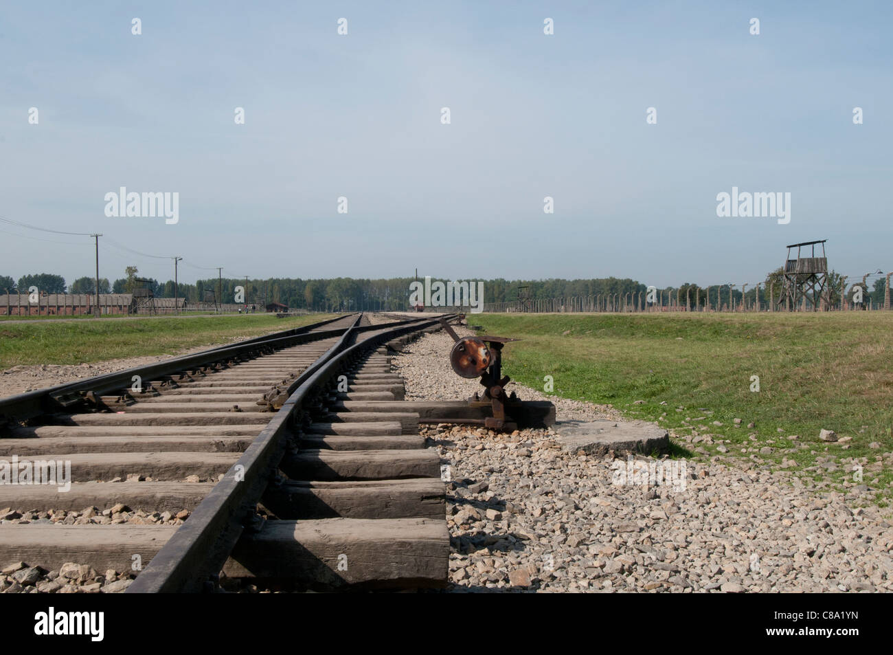 Railroad tracks leading to the new inmates arrival siding, Auschwitz II-Birkenau concentration and extermination camp, Poland Stock Photo