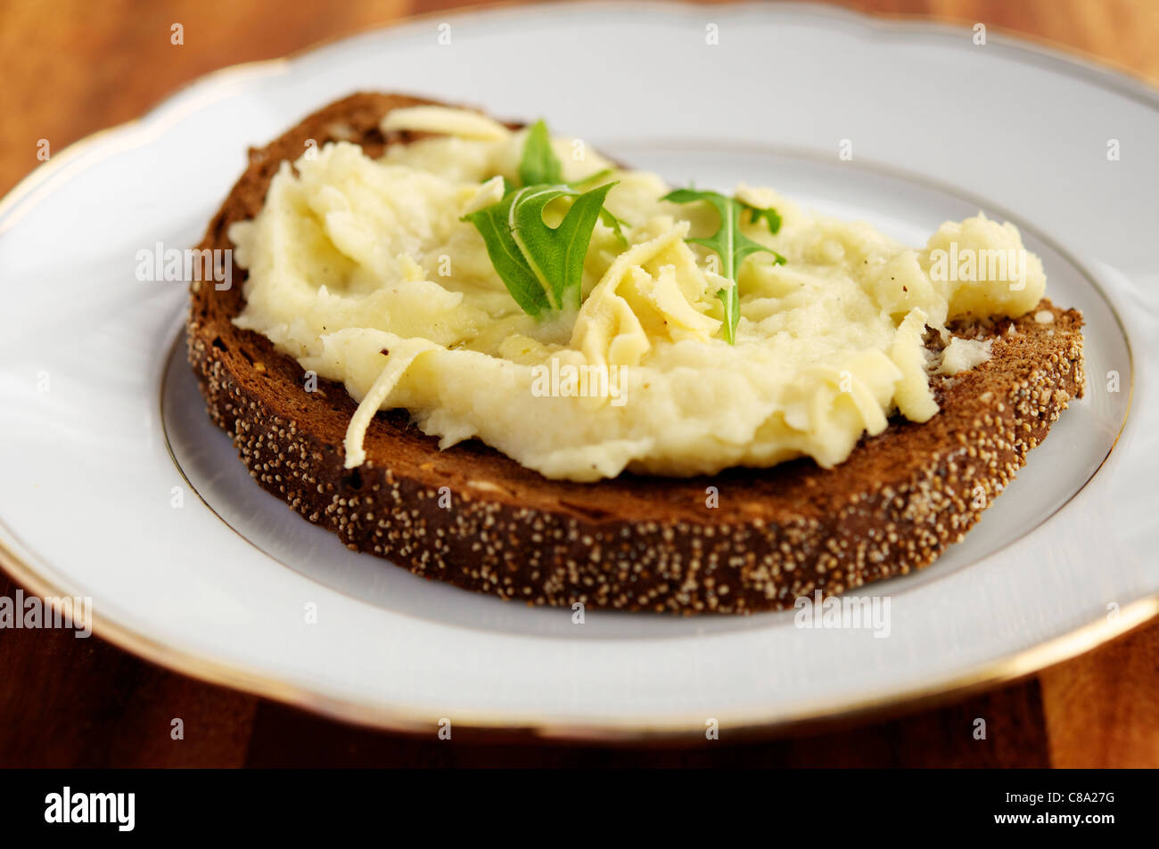 Parsnip Bruschetta with Soy Cheese, Truffle Oil and Rucola. Stock Photo