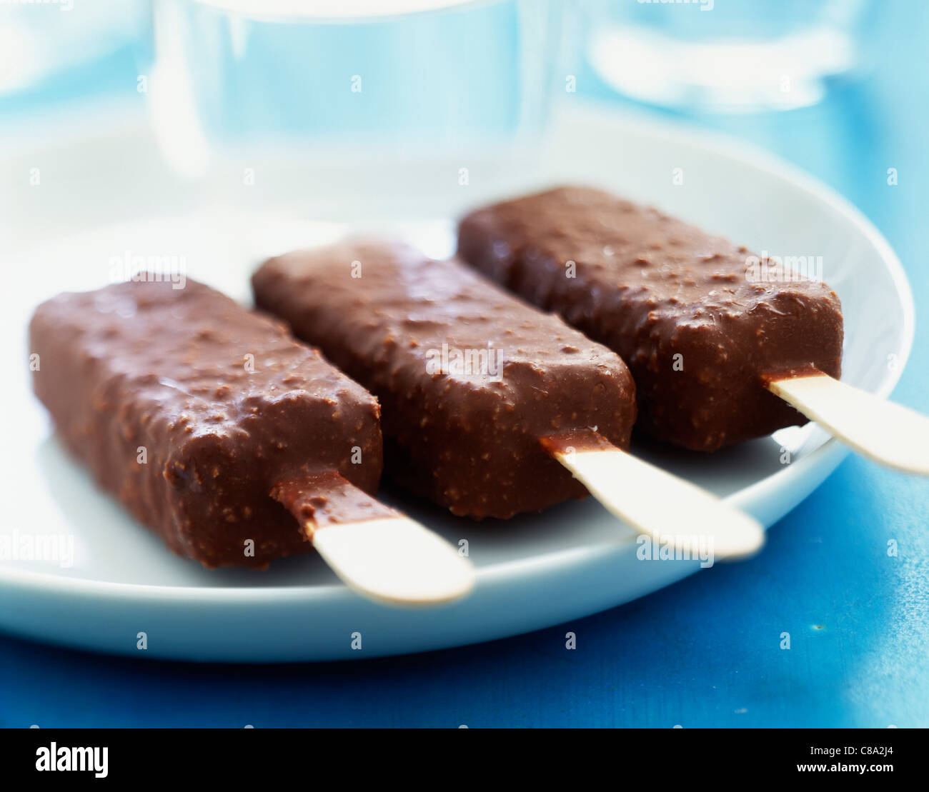 Milk chocolate ice cream lollipops Stock Photo Alamy