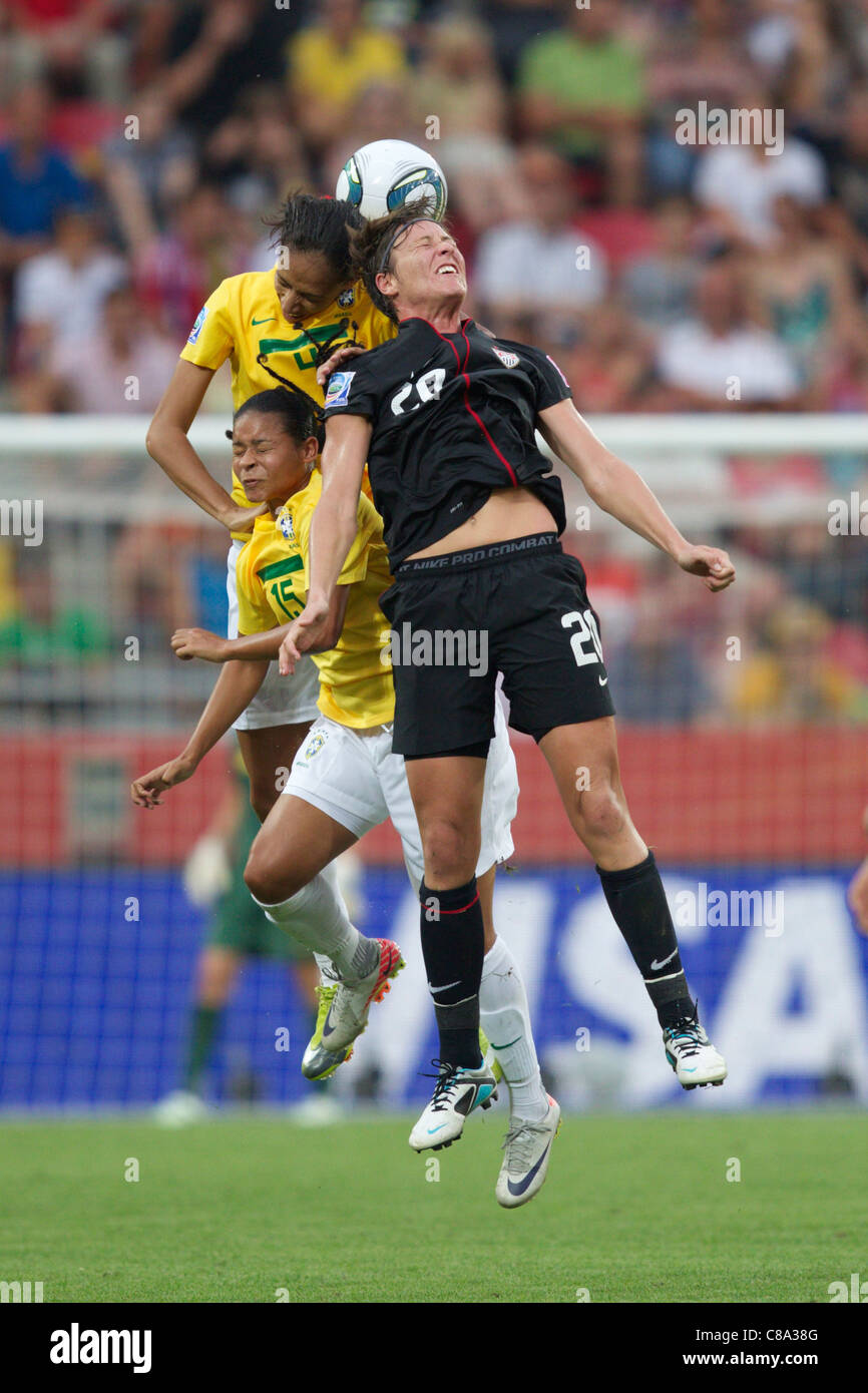 Abby Wambach of the United States (20) battles for a header with Brazil's  Francielle (15) and Aline (4) - 2011 World Cup match Stock Photo - Alamy