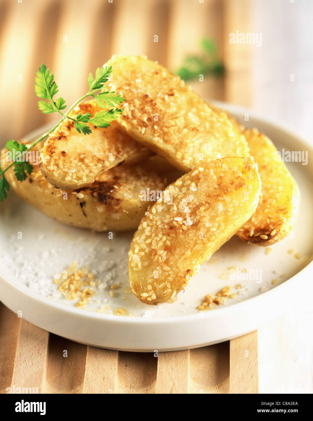 Baked potatoes with sesame seed oil Stock Photo Alamy