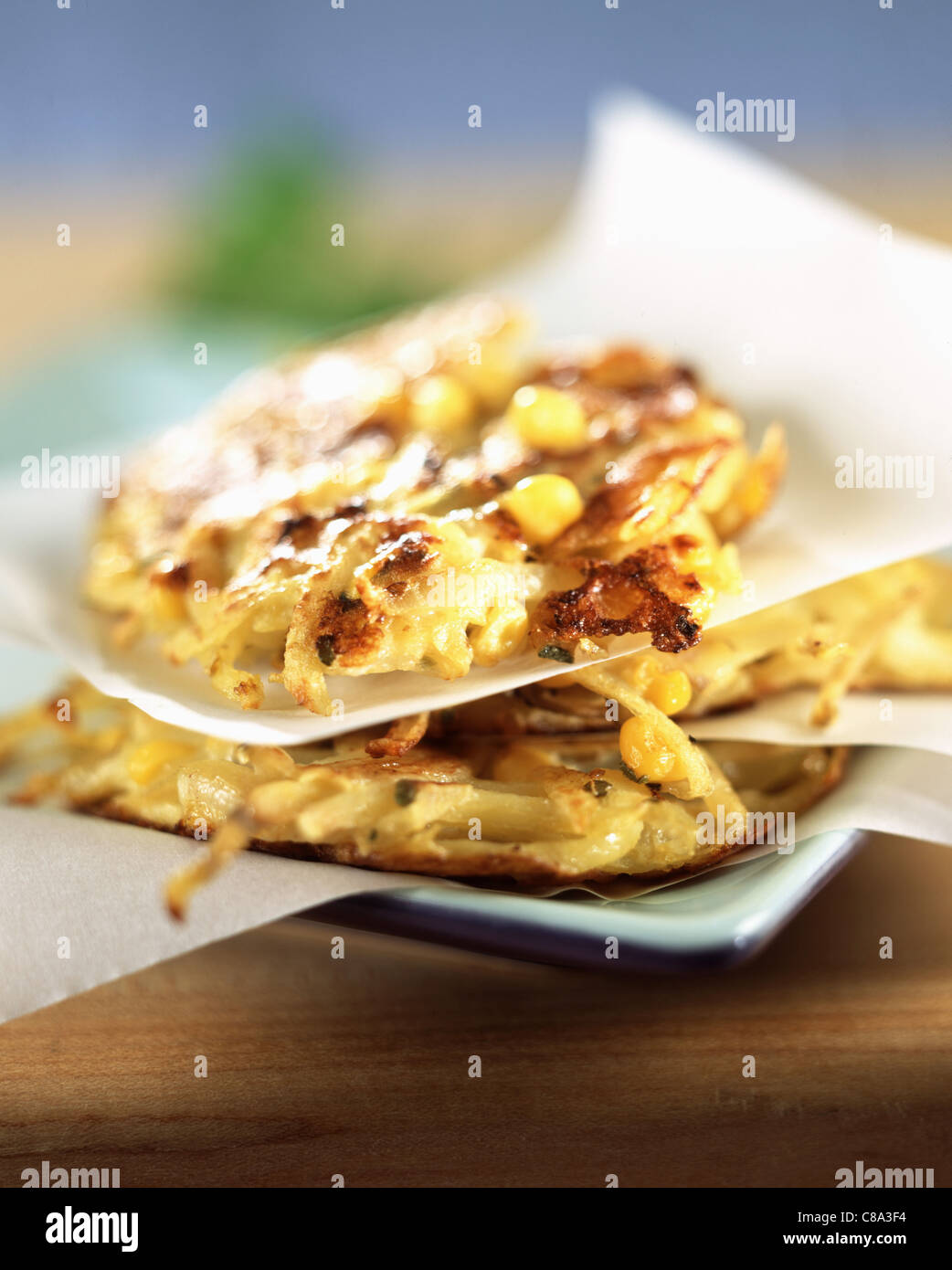 Rösti Swiss fried potatoes with corn and Mozzarella Stock Photo - Alamy