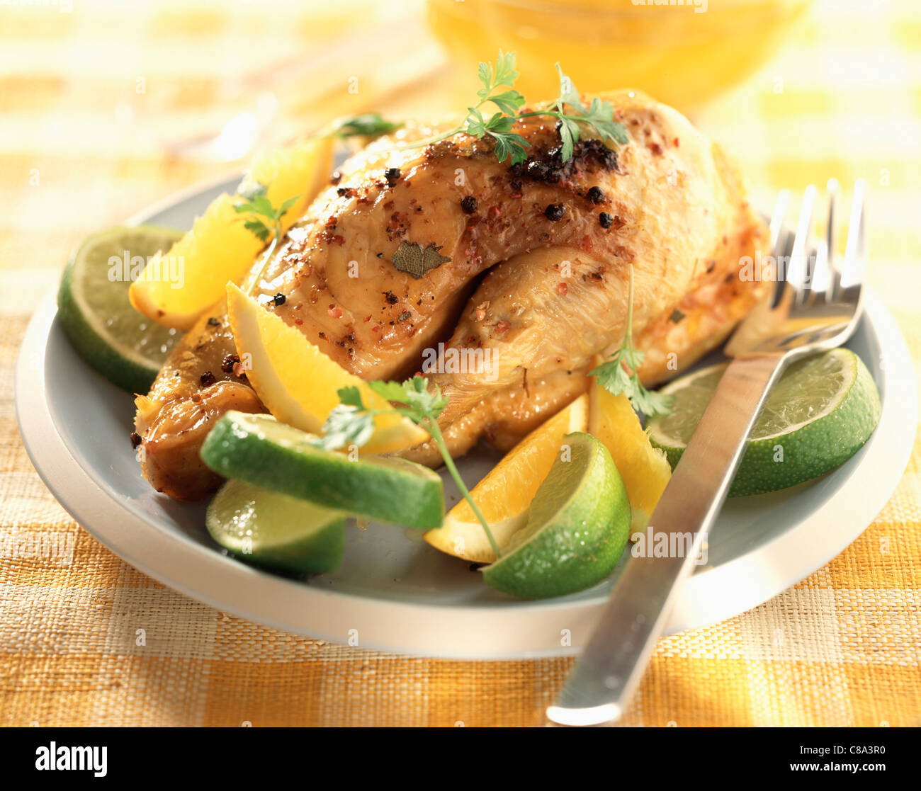 Chicken with lime and orange Stock Photo